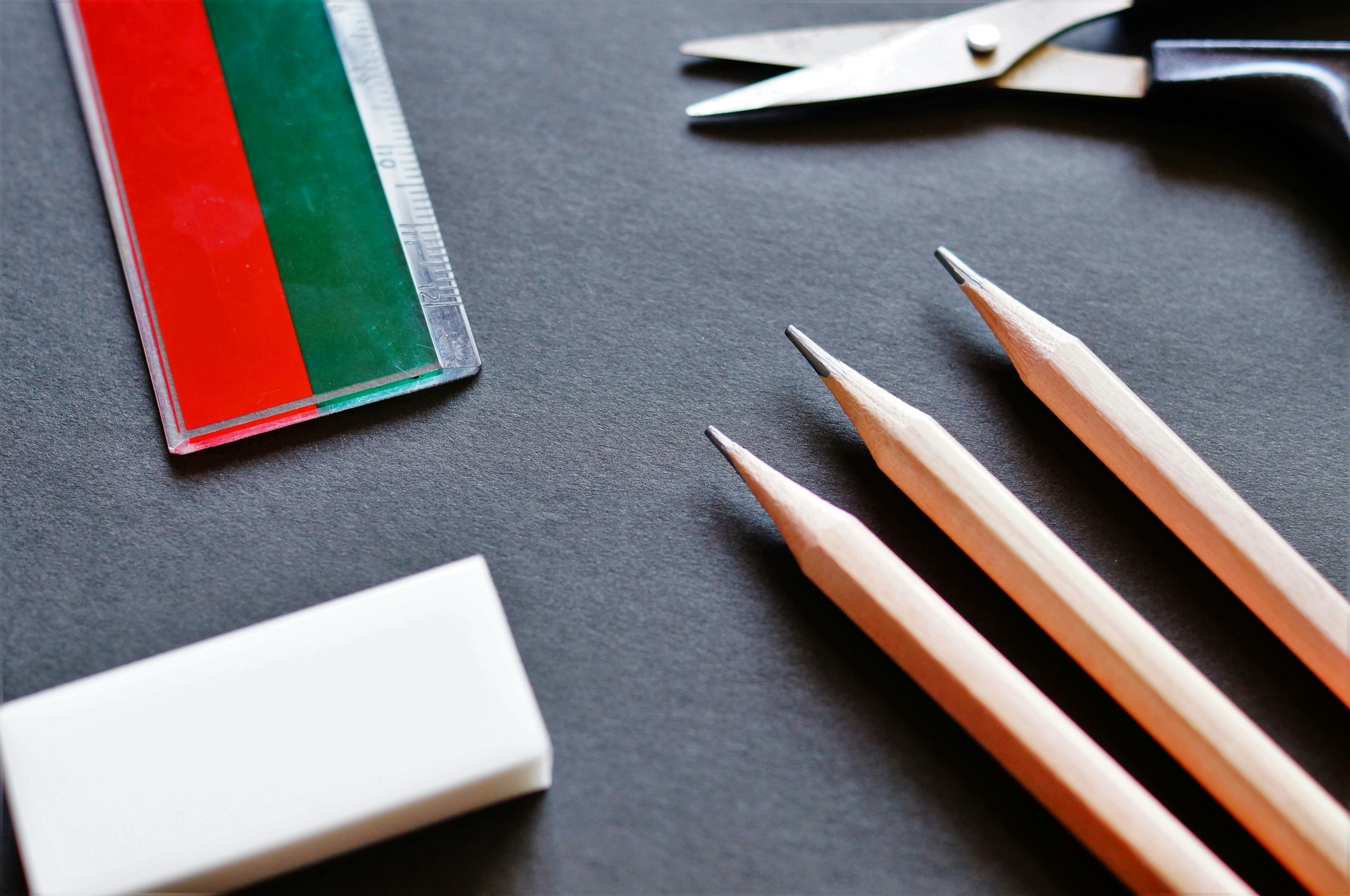 still life of pencils and notebooks on a desk