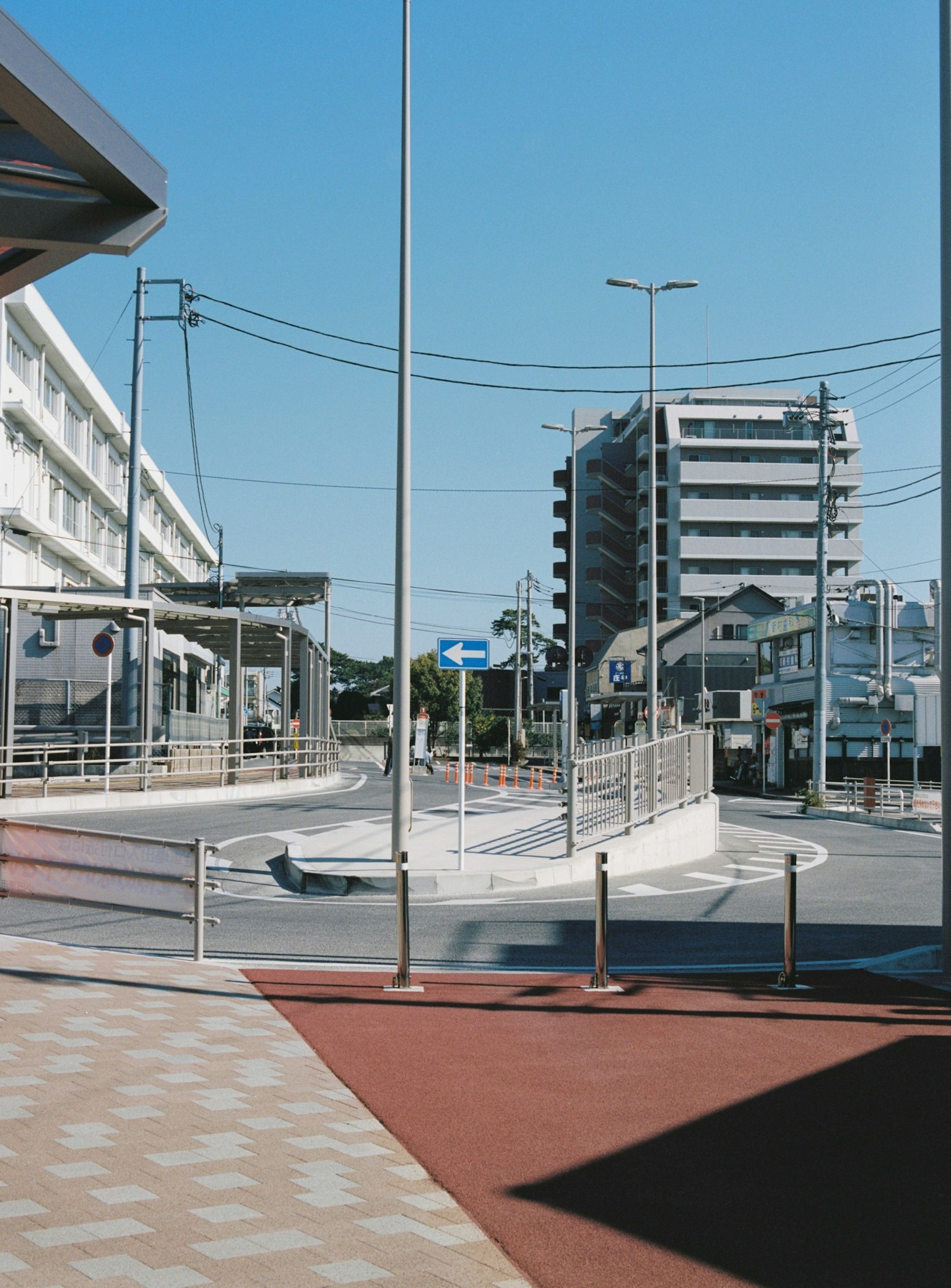 Modern buildings and smooth intersection under blue sky