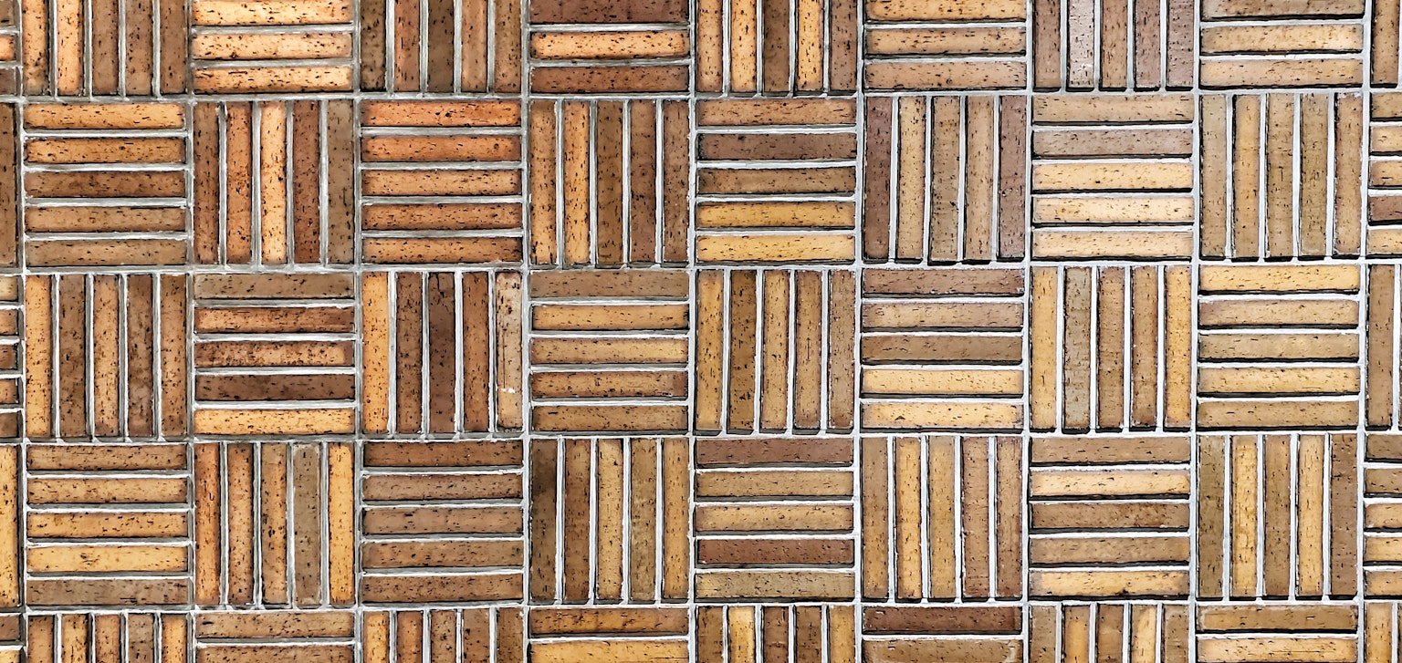 Surface of flooring with a patterned wood design