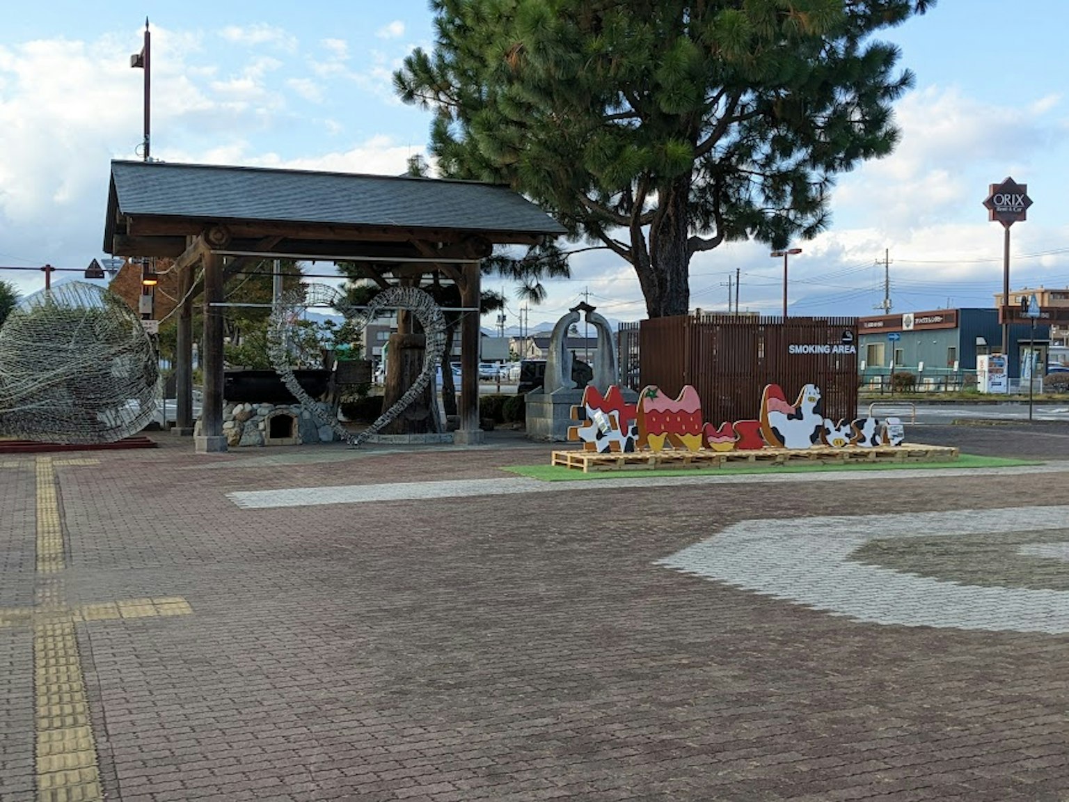 Colorful benches and wooden pavilion in a park playground