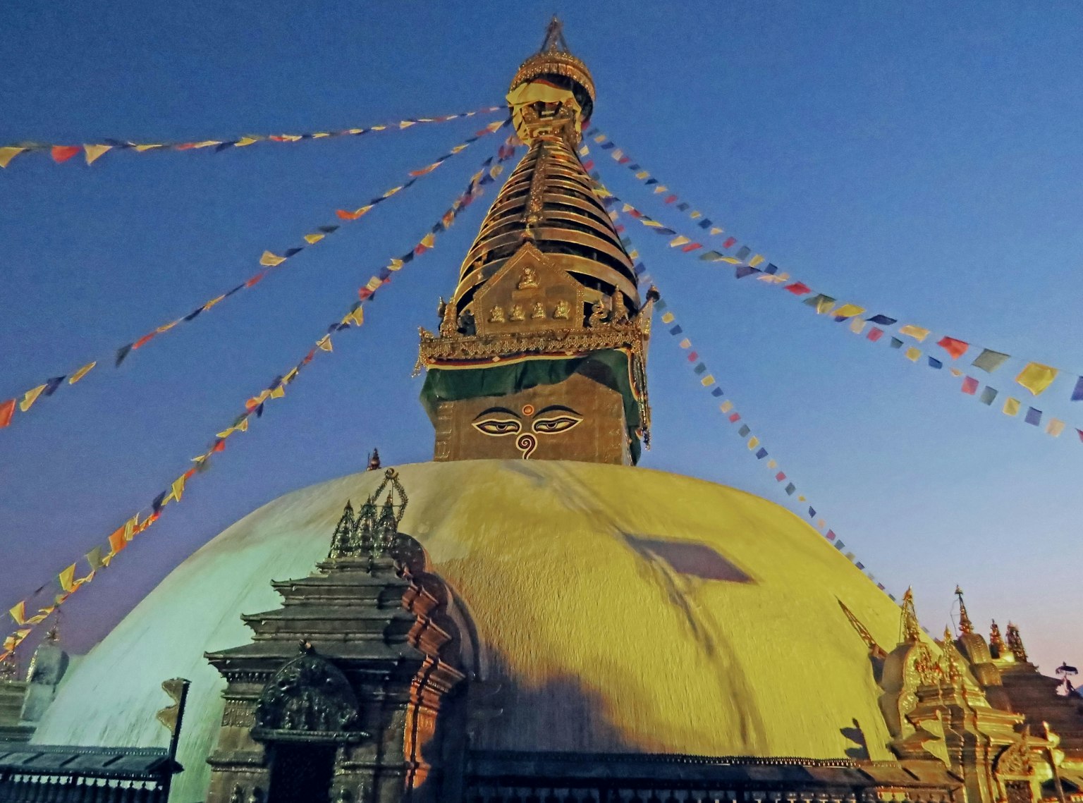 Night view of Swayambhunath stupa with prayer flags