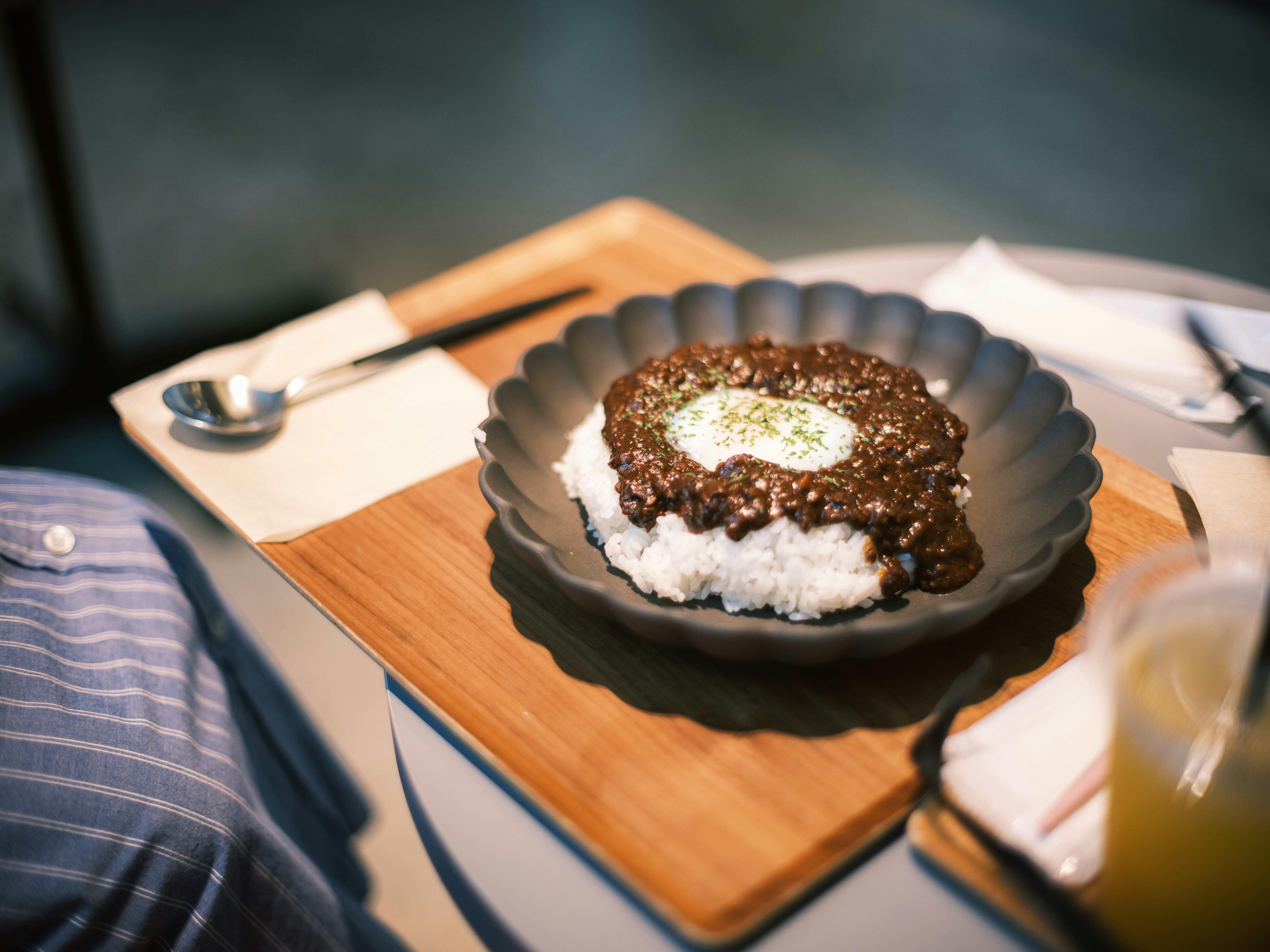 Hamburger steak on a plate on a wooden table