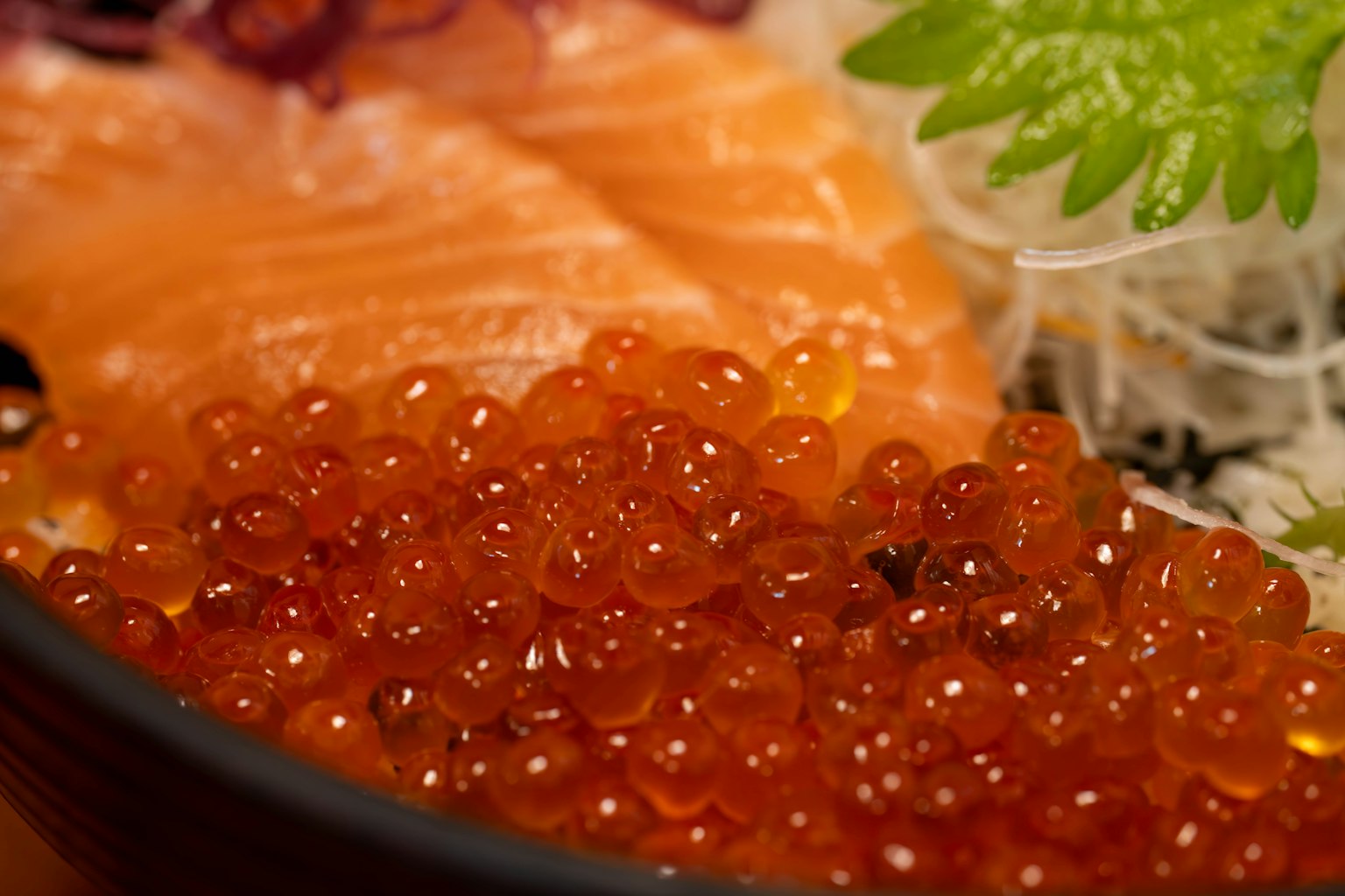Fresh salmon sashimi served with ikura in a bowl