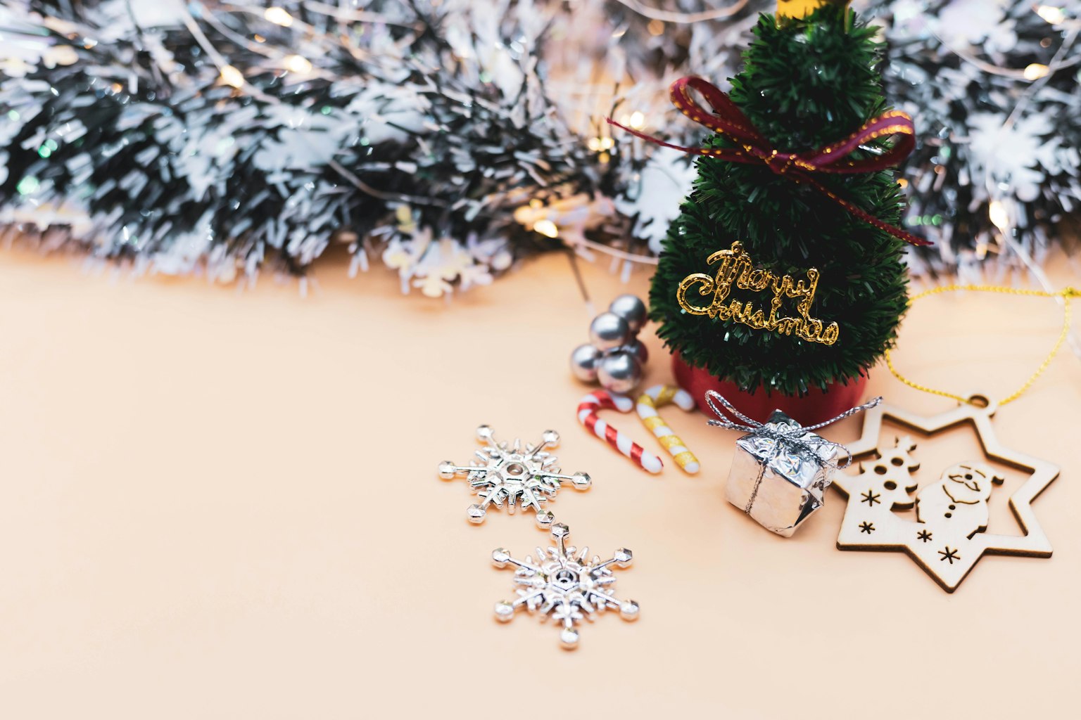 A small Christmas tree with decorations and festive items