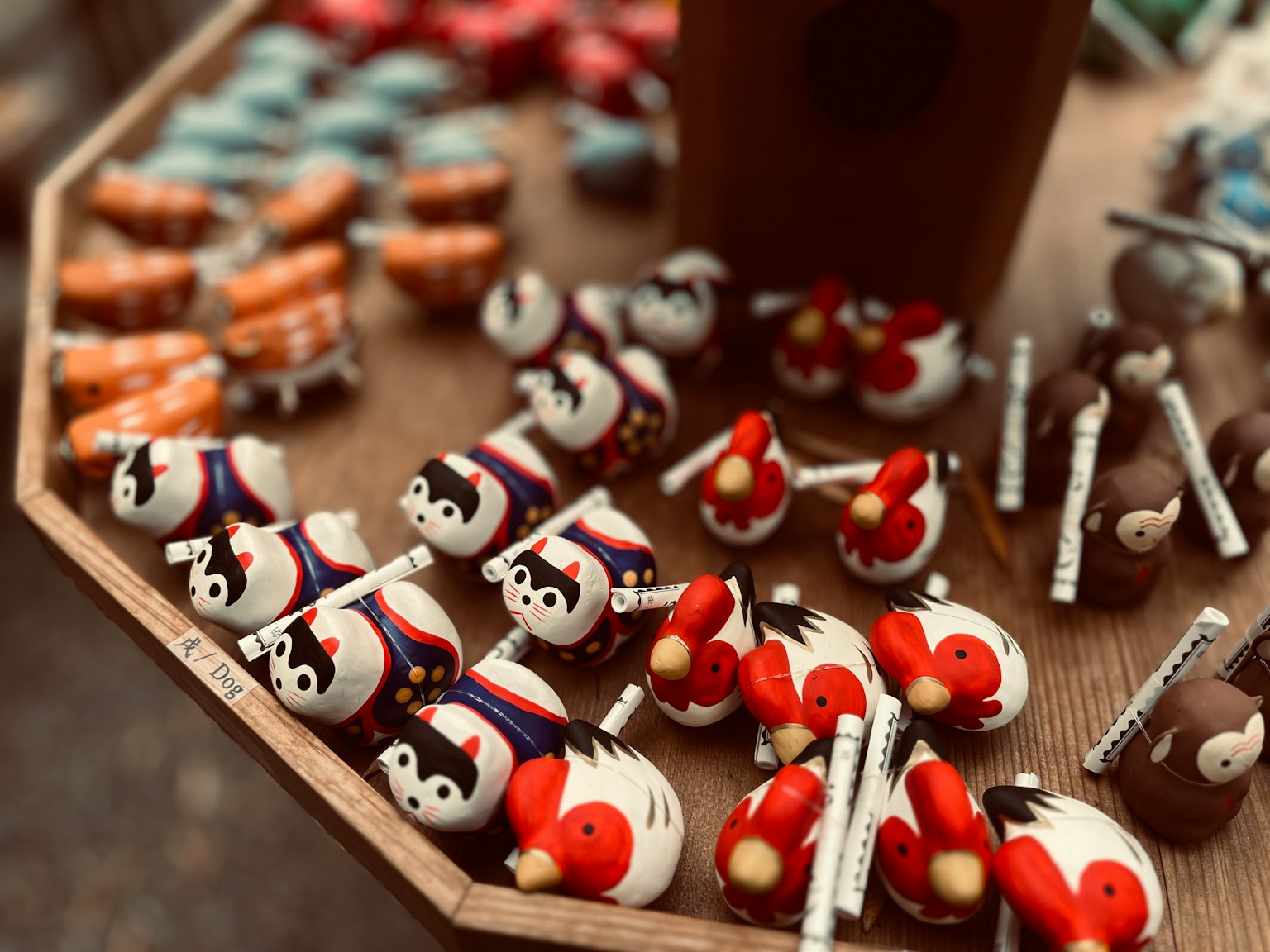 Colorful small character figurines displayed on a wooden table