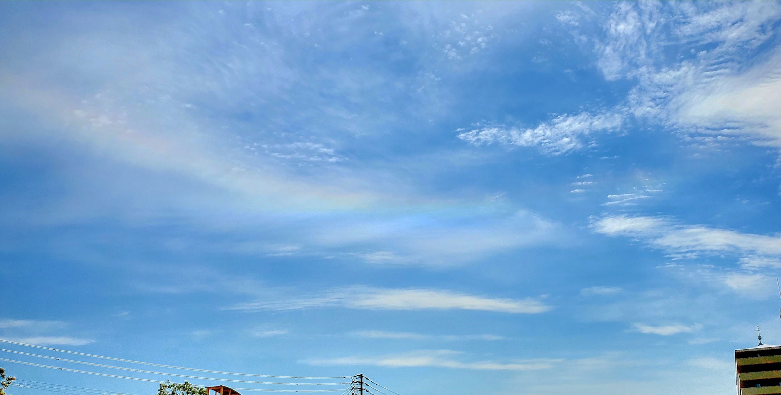 Clear blue sky with wispy clouds on a sunny day