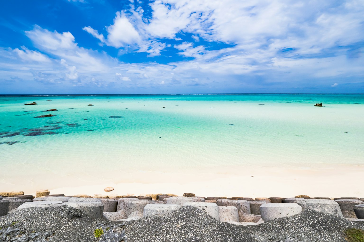 Beach landscape with blue sky and clear turquoise water