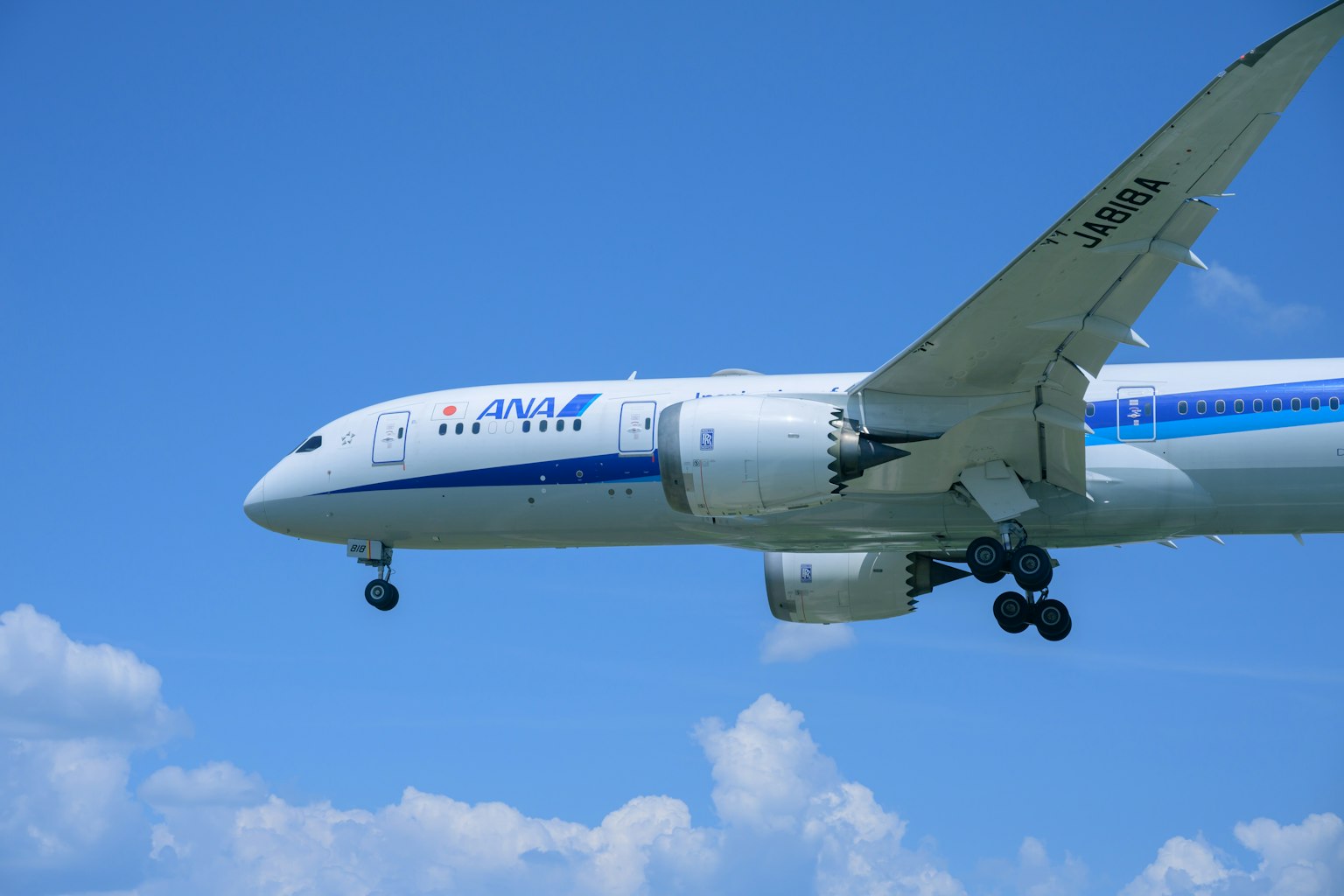 Airplane approaching against a blue sky