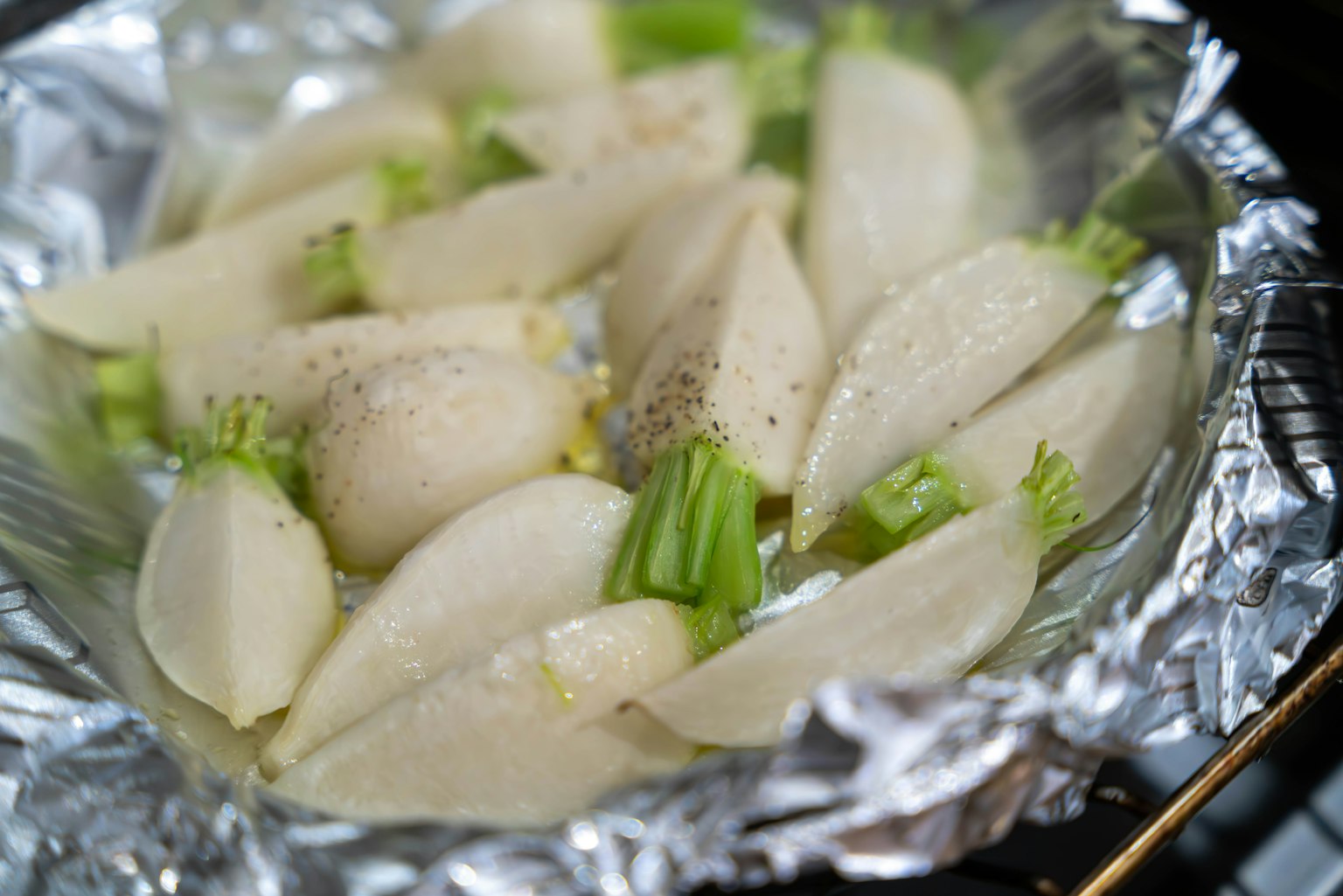 A dish of celery and white vegetables prepared for steaming