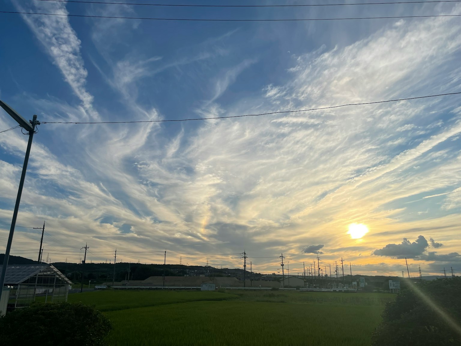 Beautiful landscape with clouds in a blue sky and a sunset