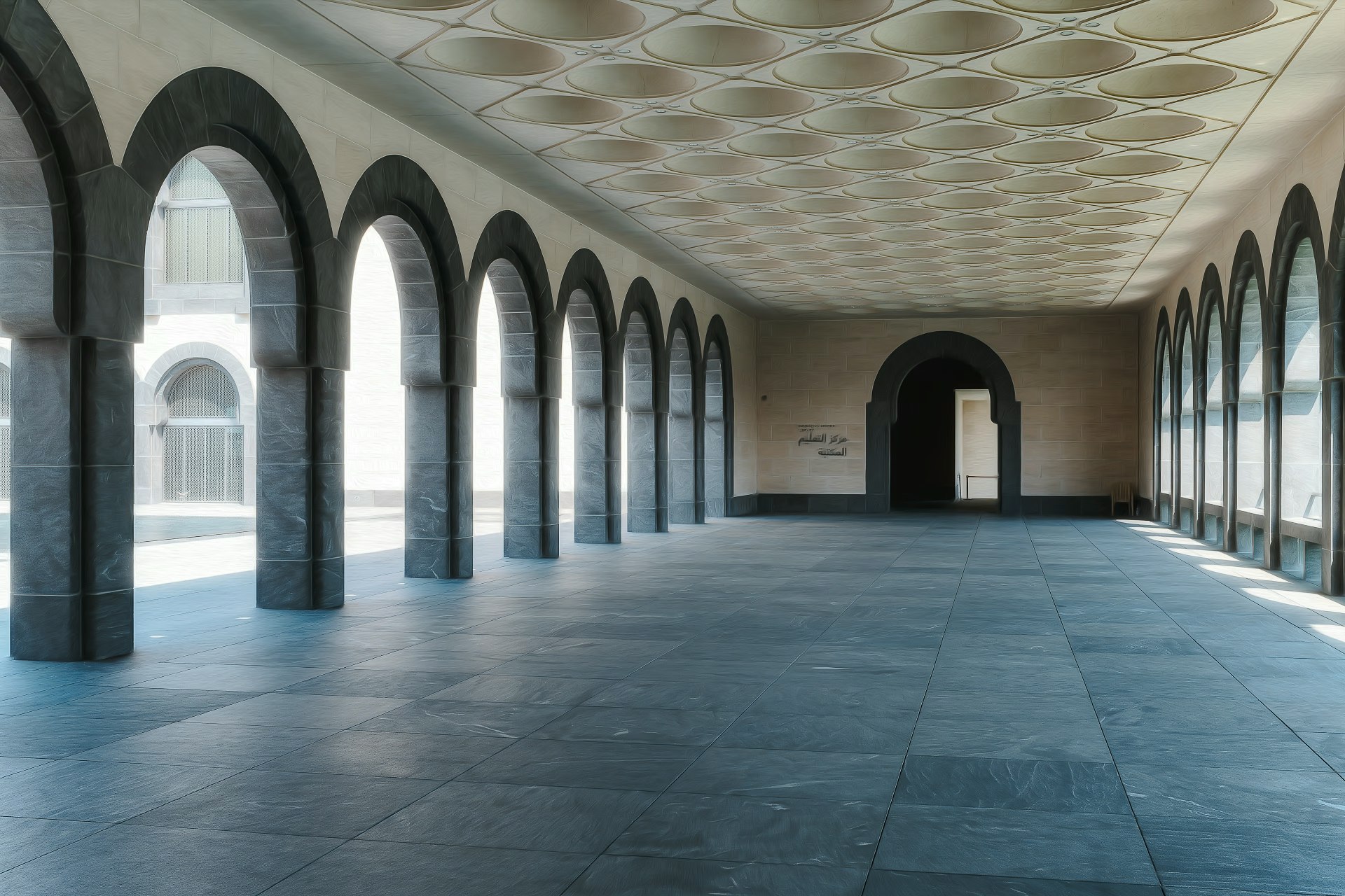 long arched corridor with stone floor