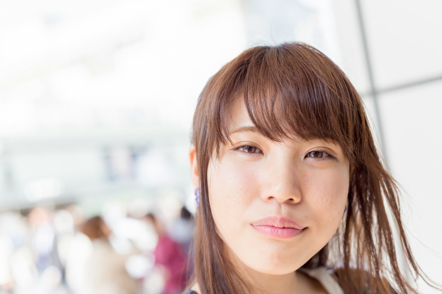 Portrait of a woman with blurred background of people