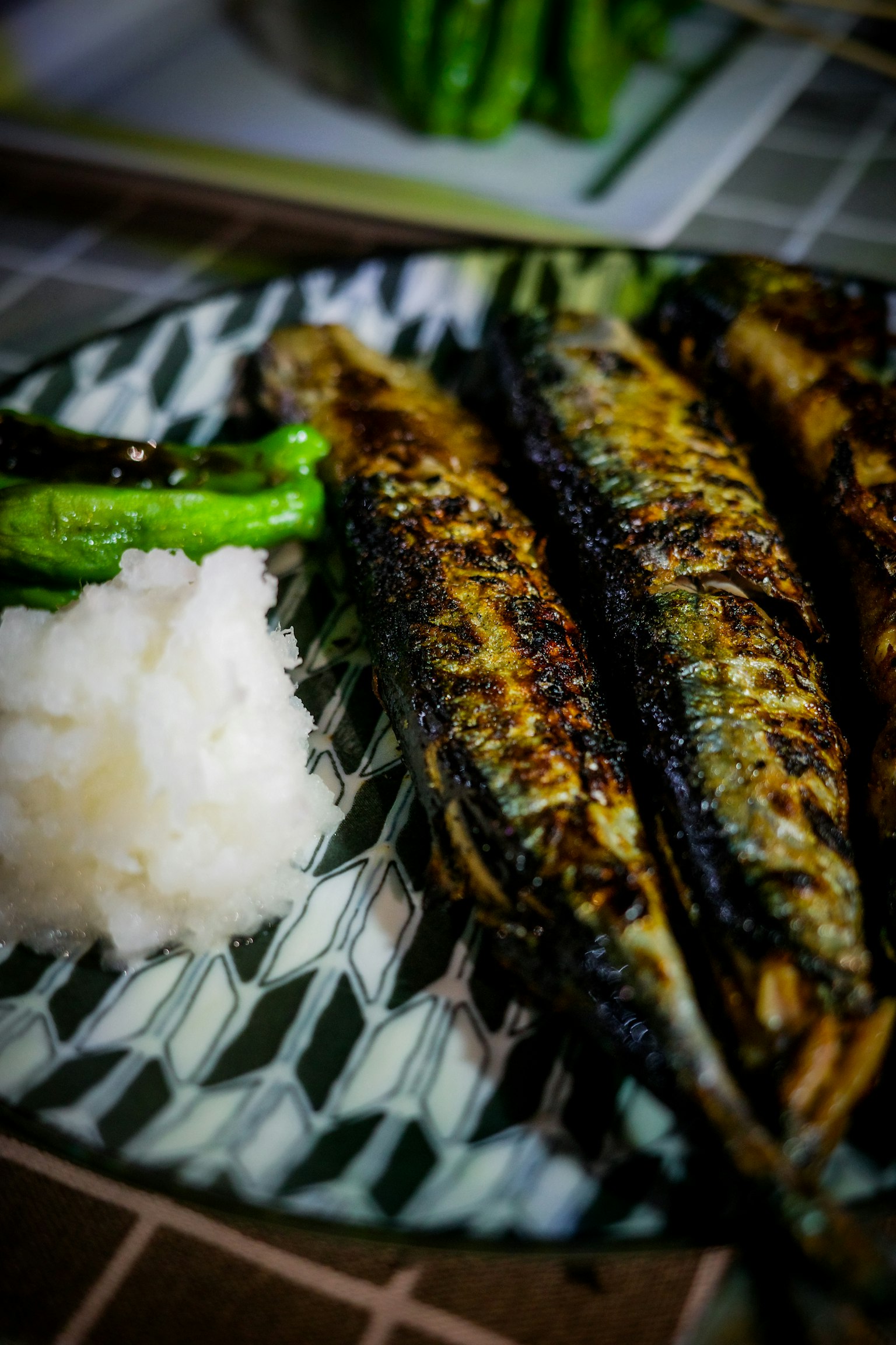 Grilled sanma fish served with grated daikon and green peppers