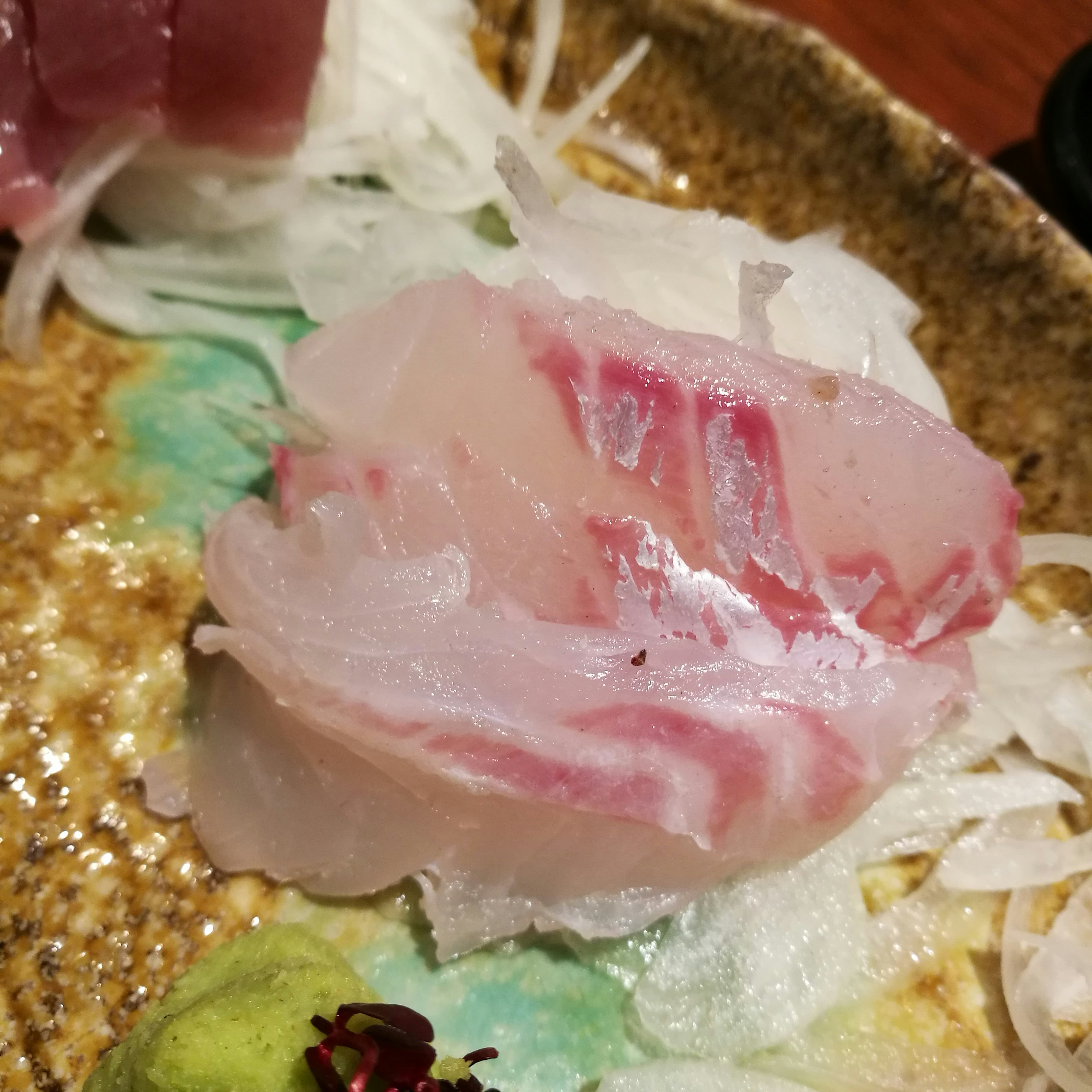 assorted sashimi with a slice of tuna