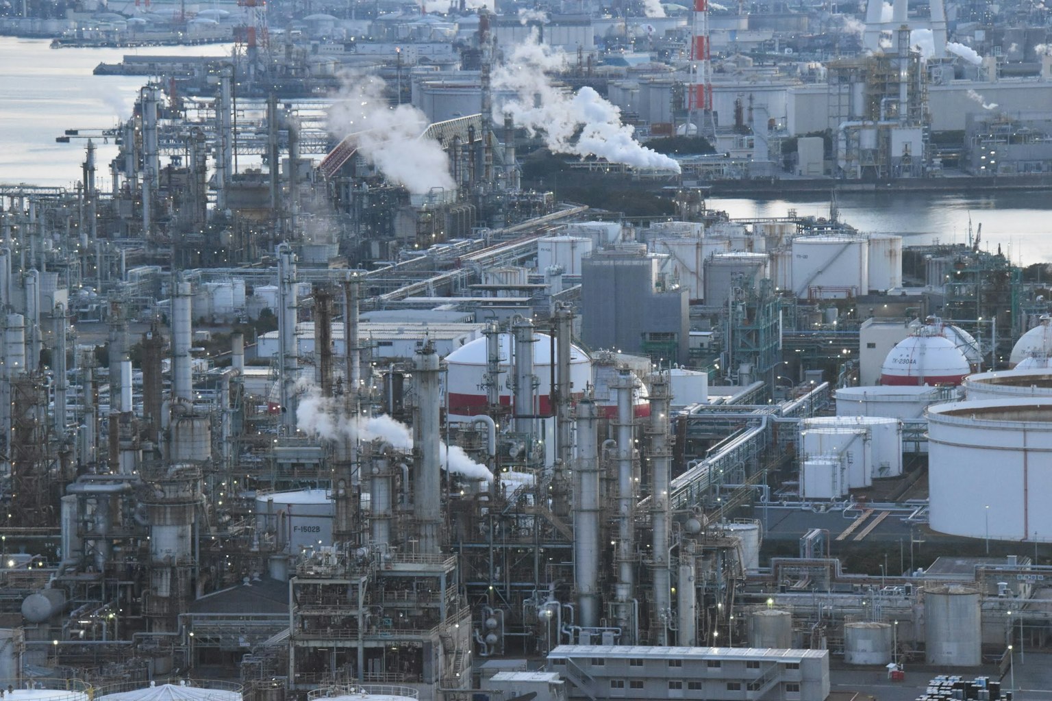 Industrial area with smokestacks and storage tanks