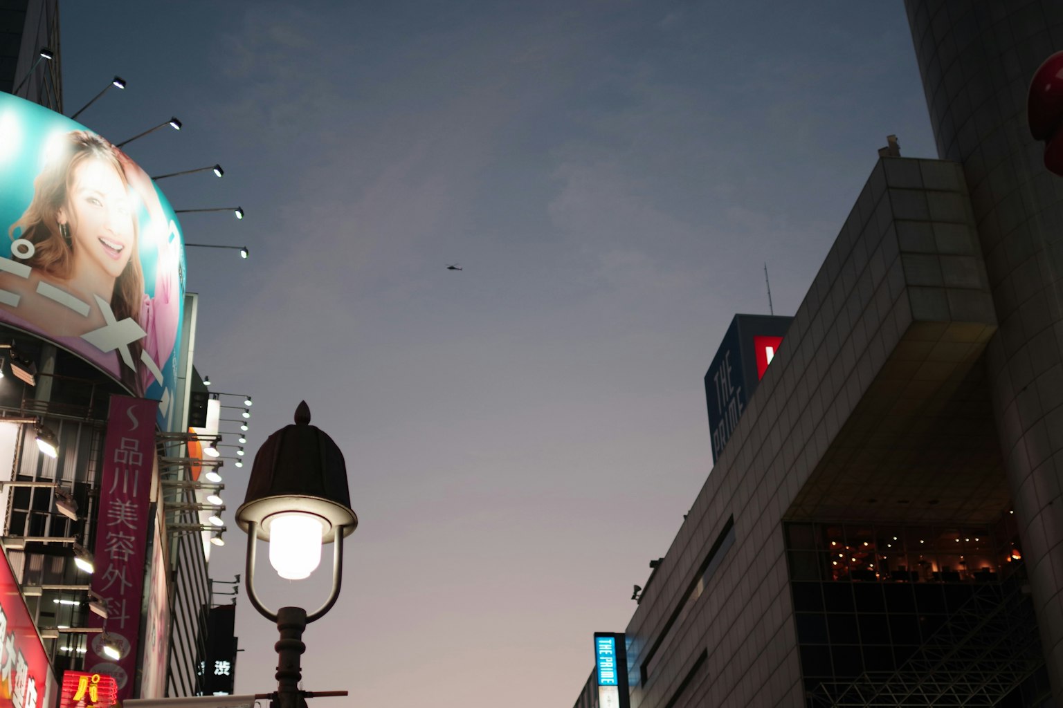Beautiful view of cityscape at dusk with a street lamp