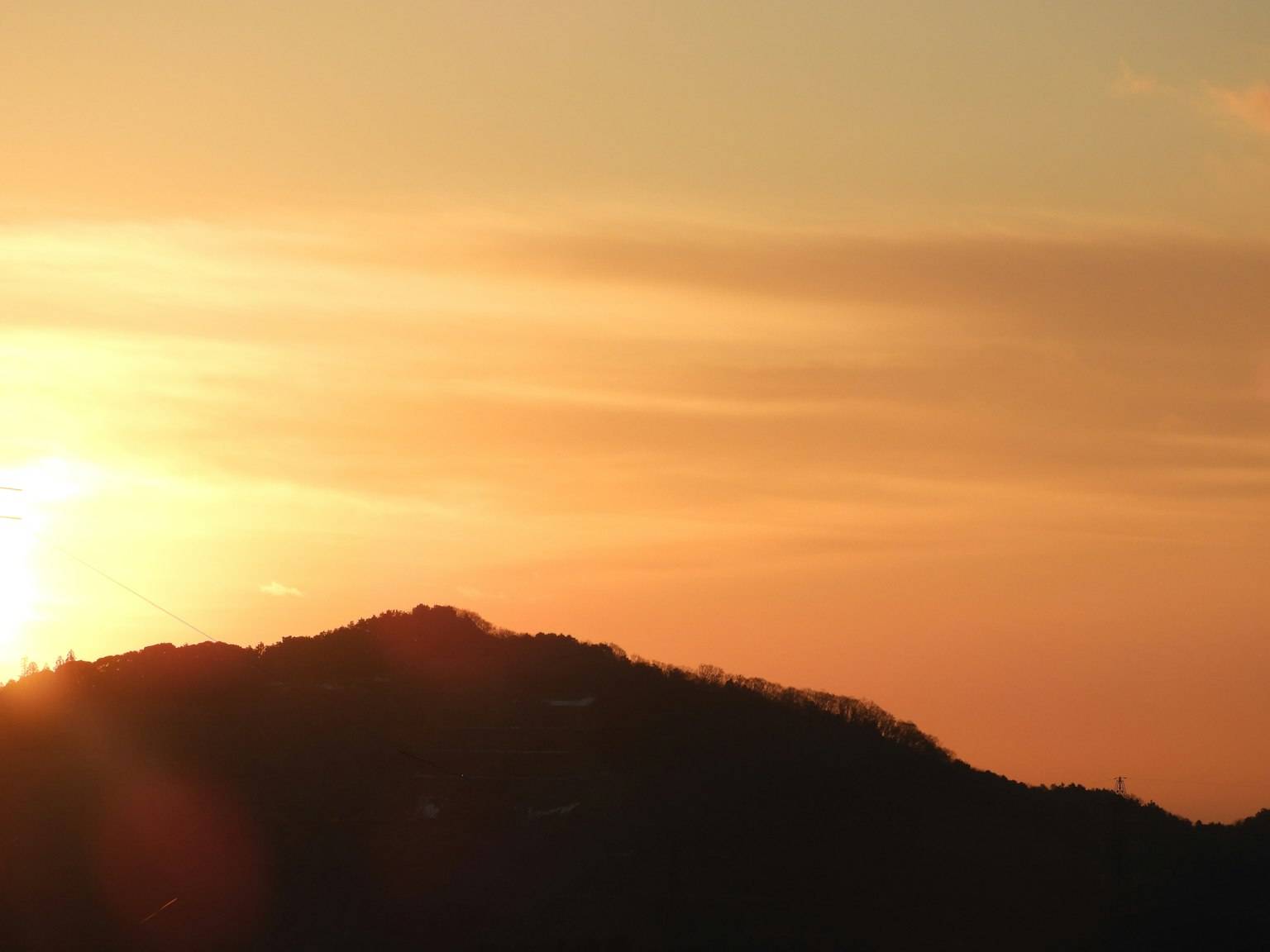 Silhouette of a mountain at sunset