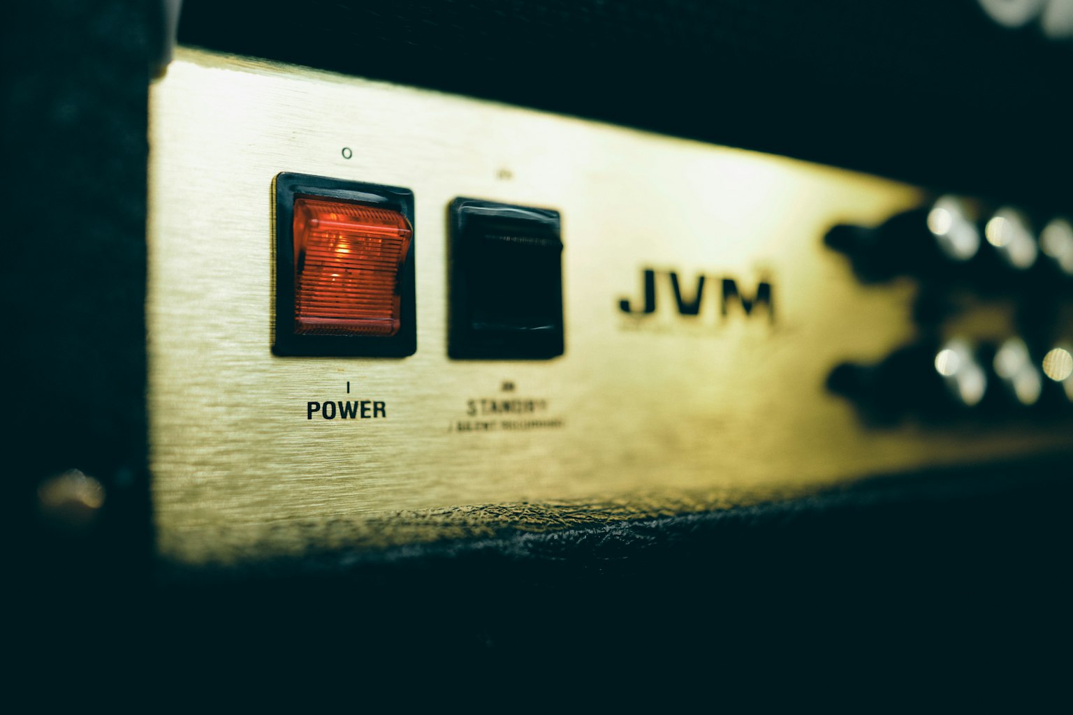 Close-up of JVM amplifier power and standby buttons
