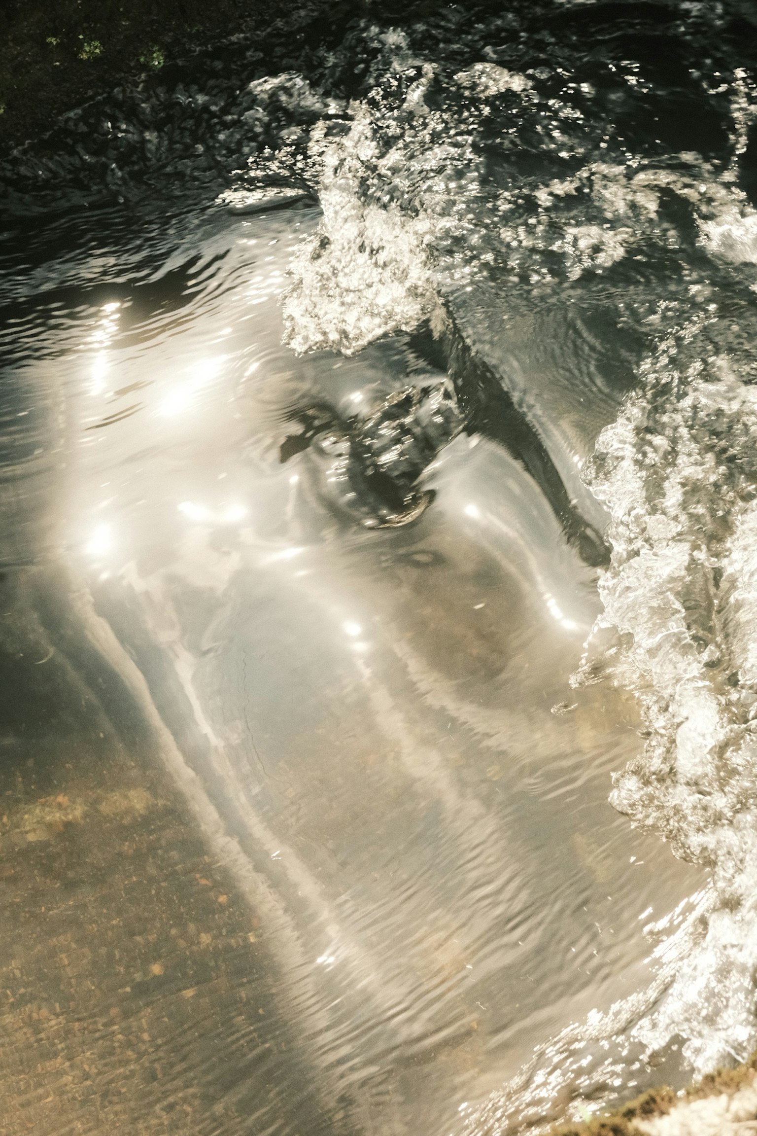 Image of water surface with reflections and ripples