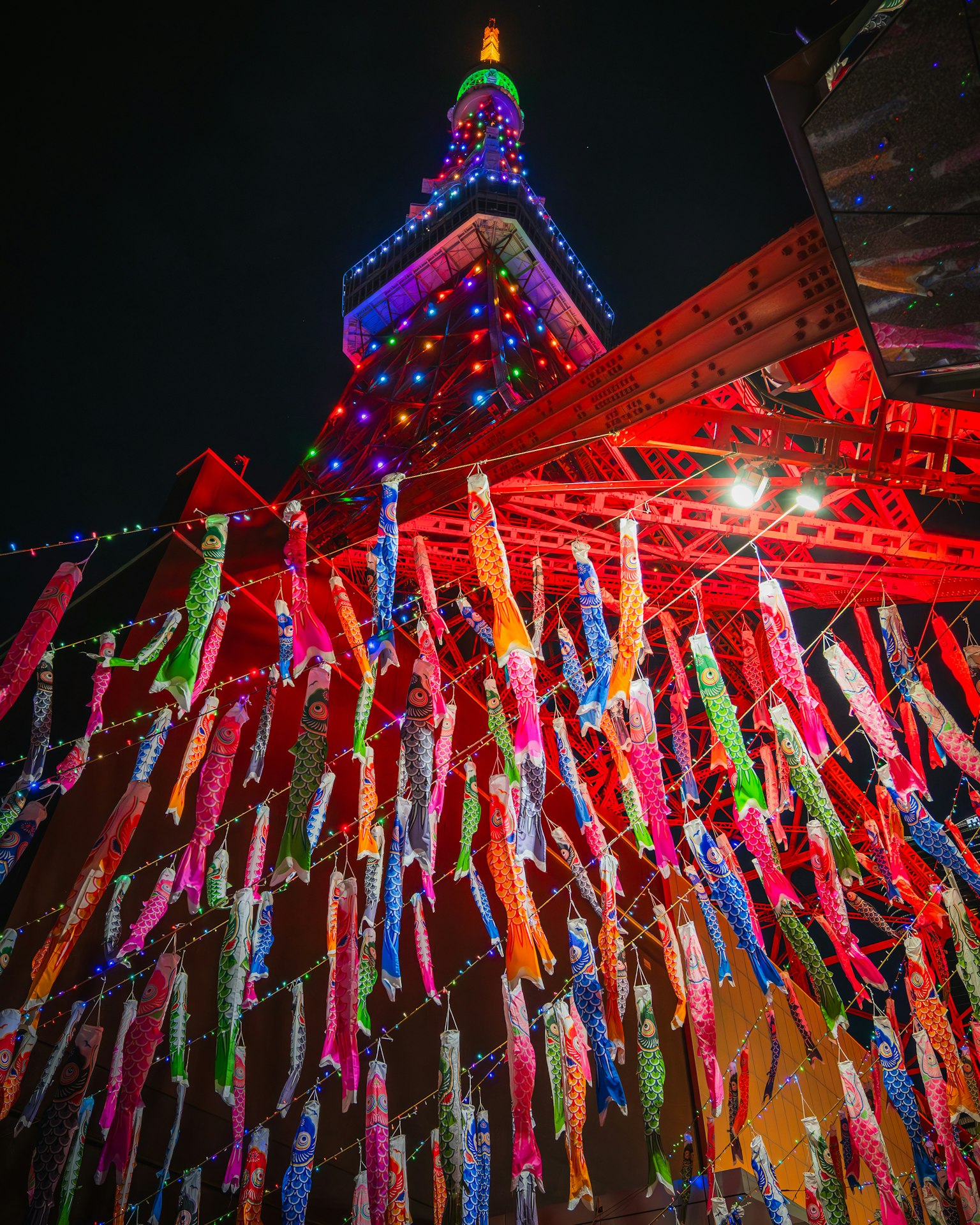 Tokyo Tower illuminated at night with colorful decorations