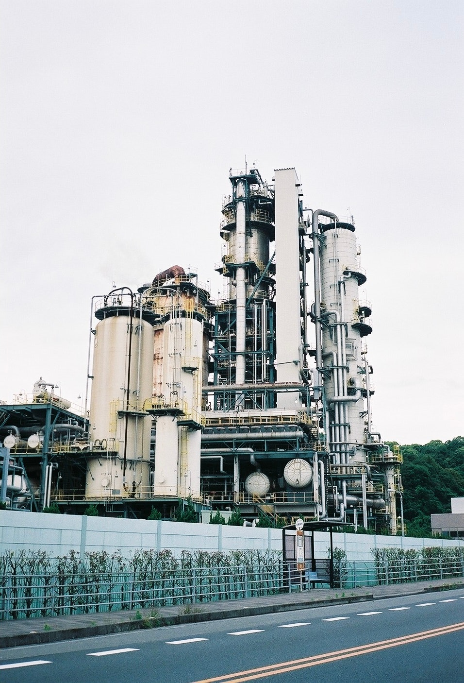 outdoor industrial plant with pipes and towering equipment