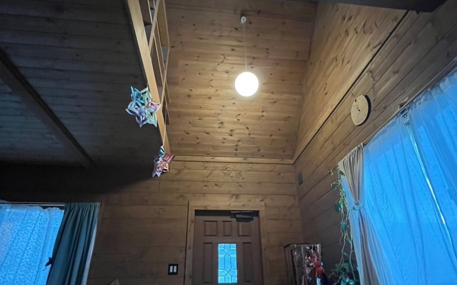 Interior of a wooden room with high ceiling and bright light