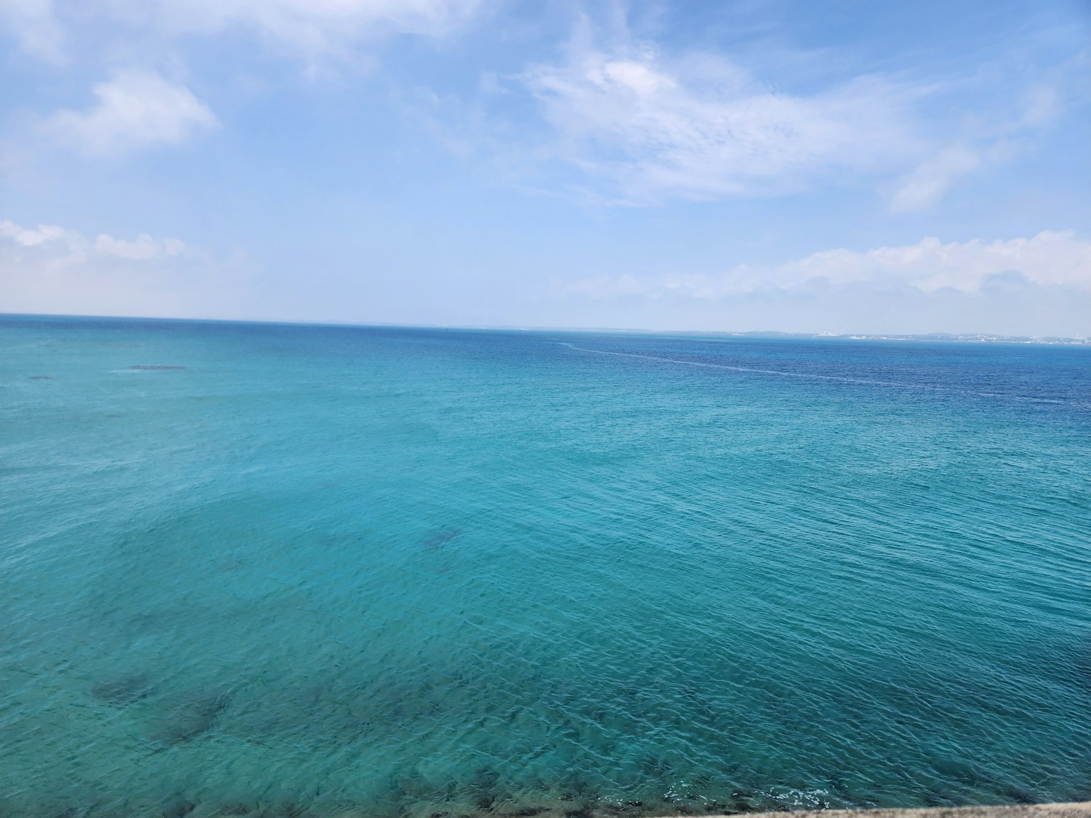 Vast turquoise ocean under a clear blue sky