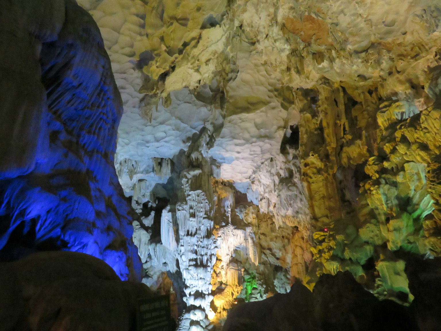 Colorful lighting inside a cave with unique rock formations