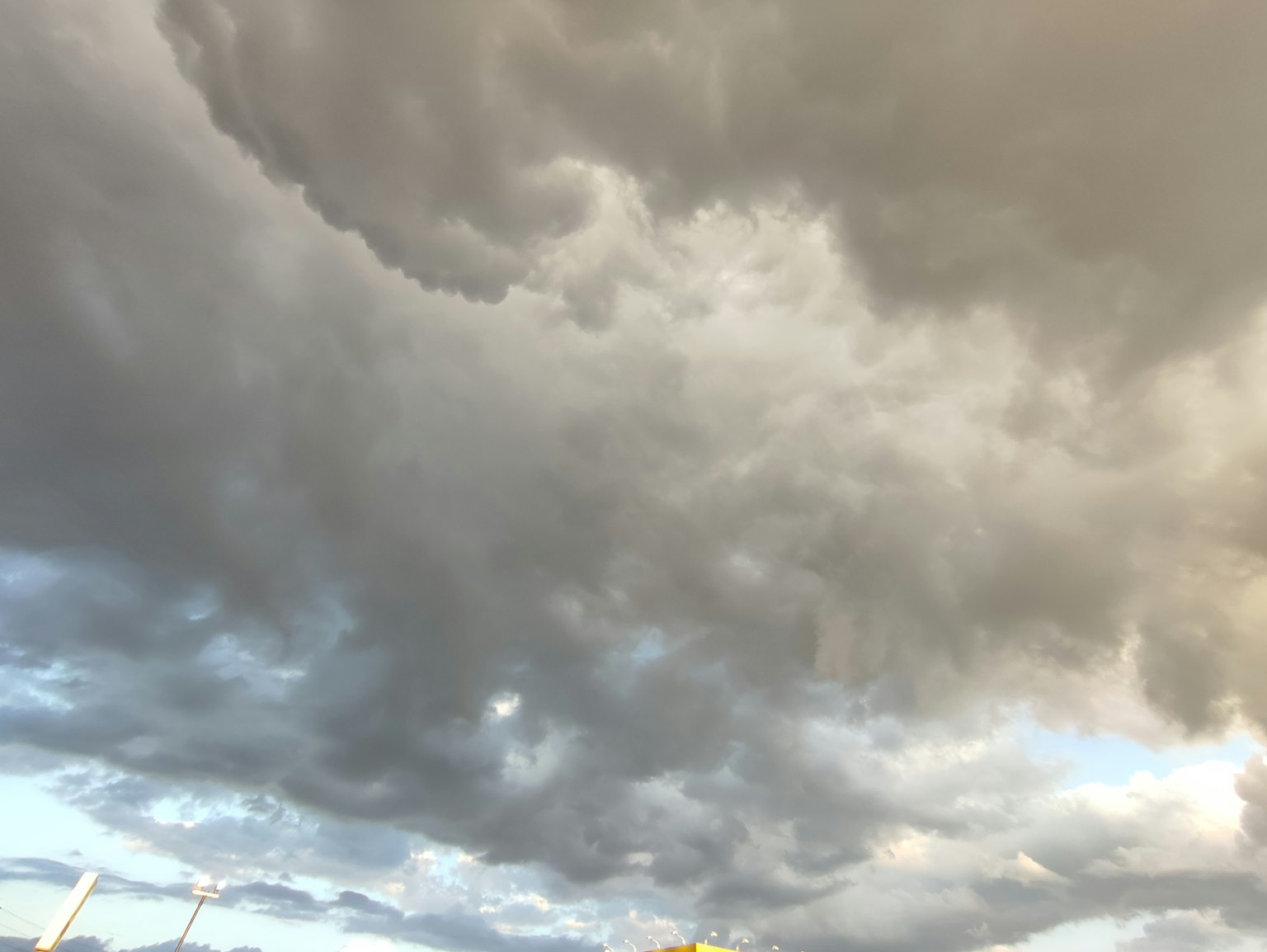 A dramatic sky filled with dark, swirling clouds
