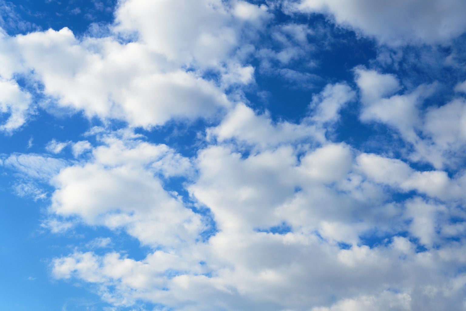 Beautiful scene of blue sky with fluffy white clouds