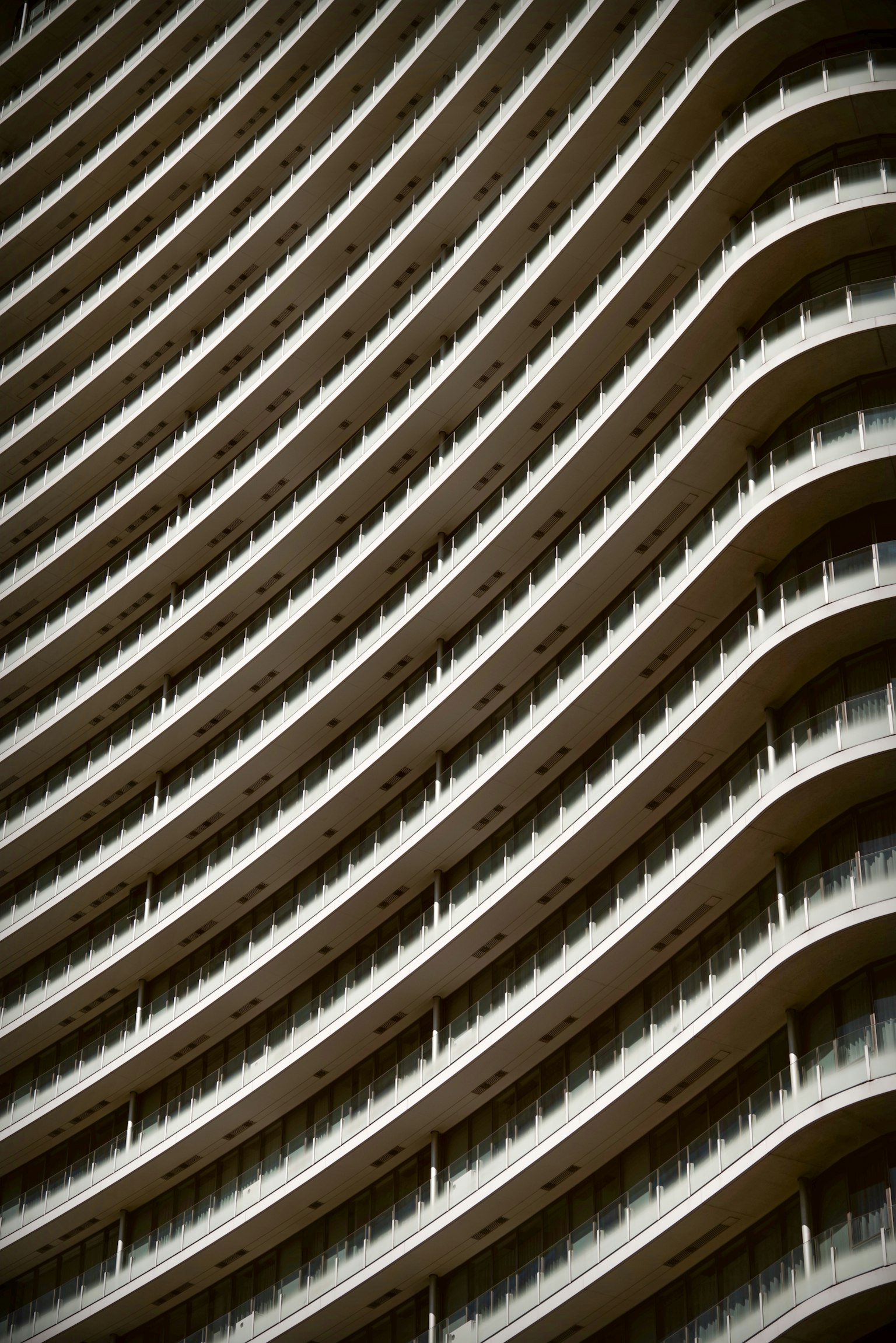 Modern skyscraper facade with curved balconies