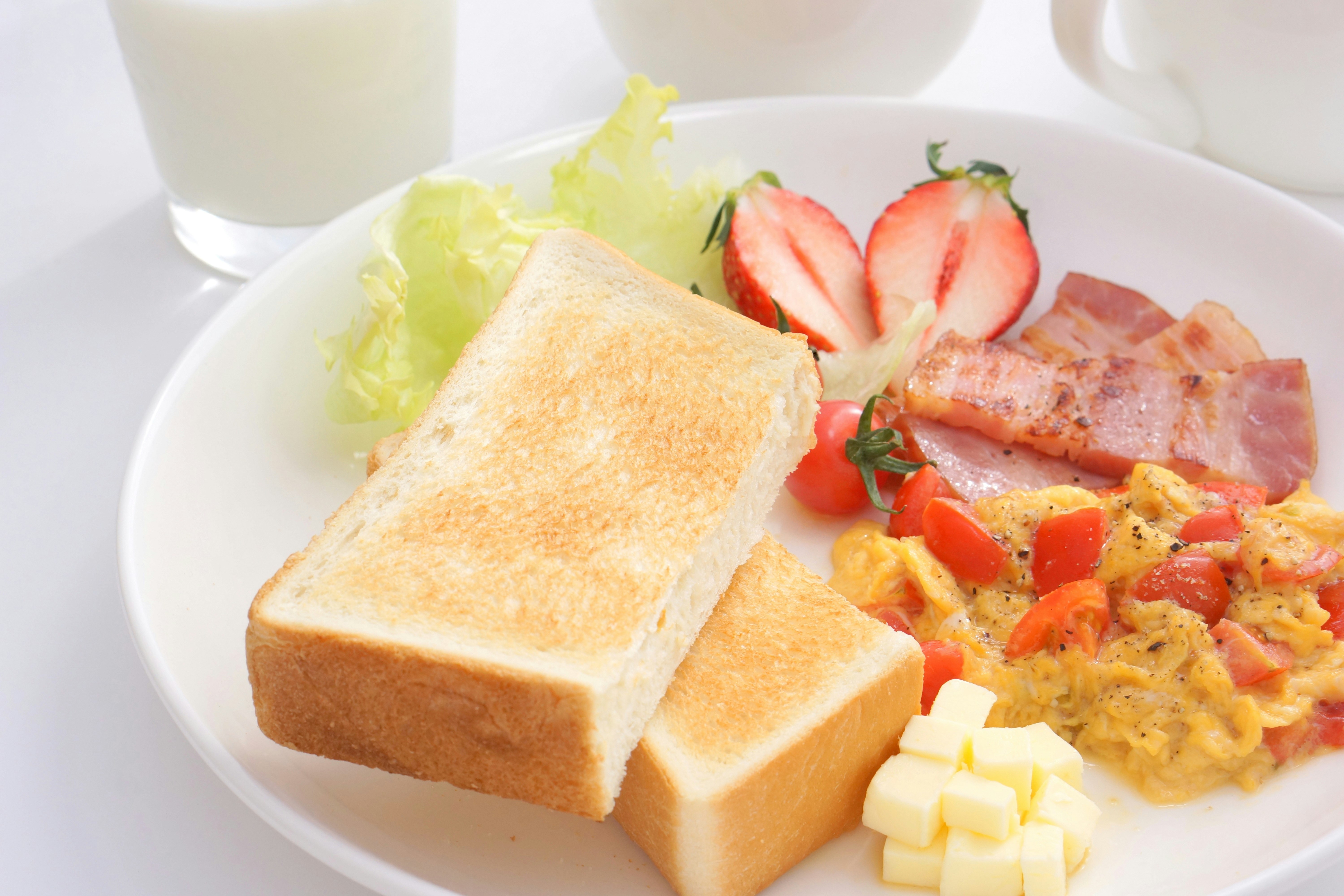 breakfast plate with toast and scrambled eggs
