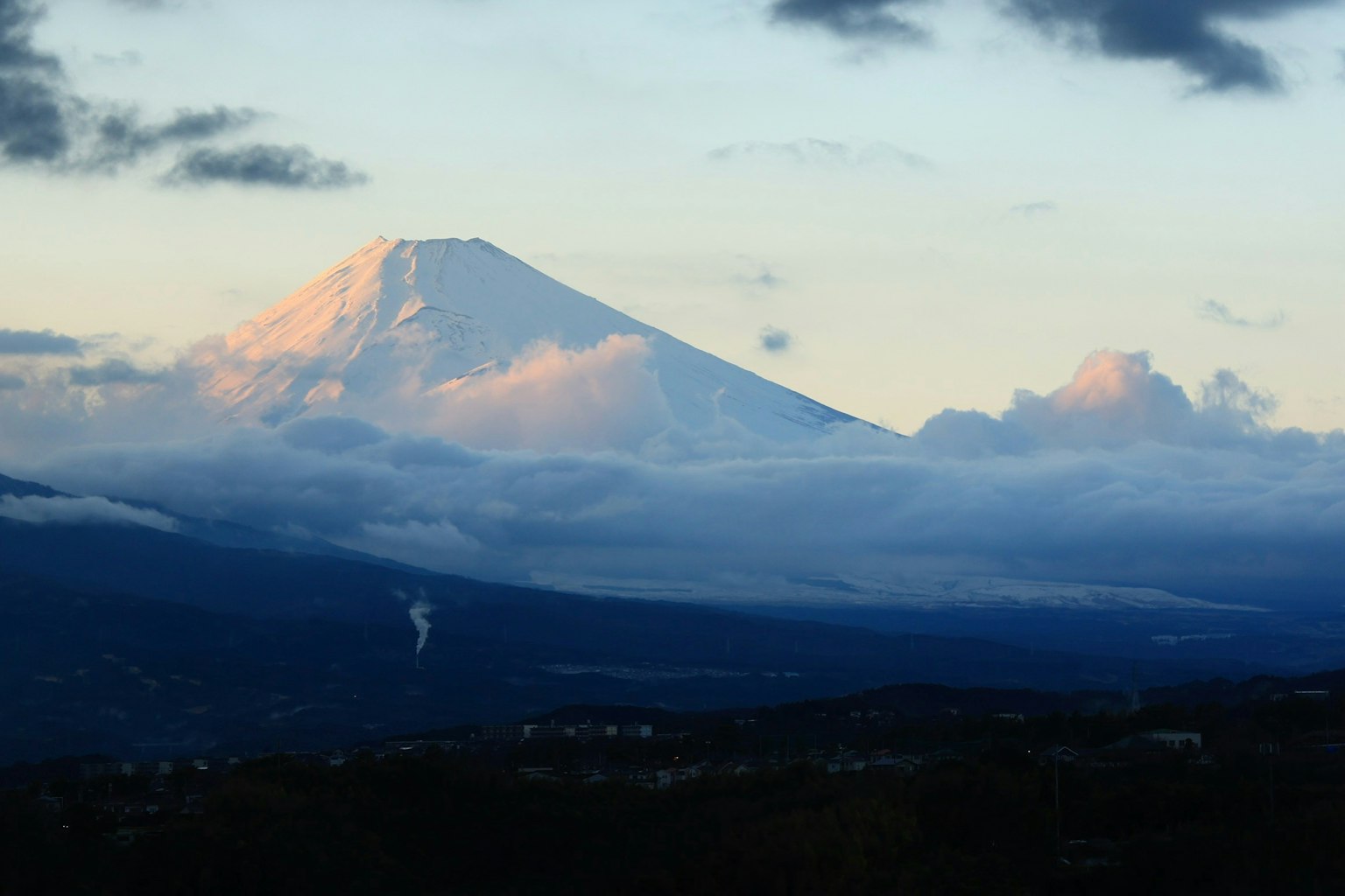 Beautiful view of Mount Fuji with a snow-capped peak and clouds