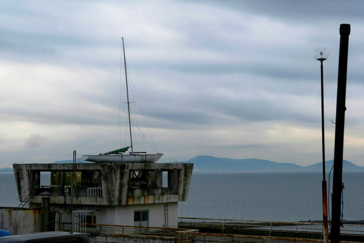 Old tower facing the sea with a cloudy sky