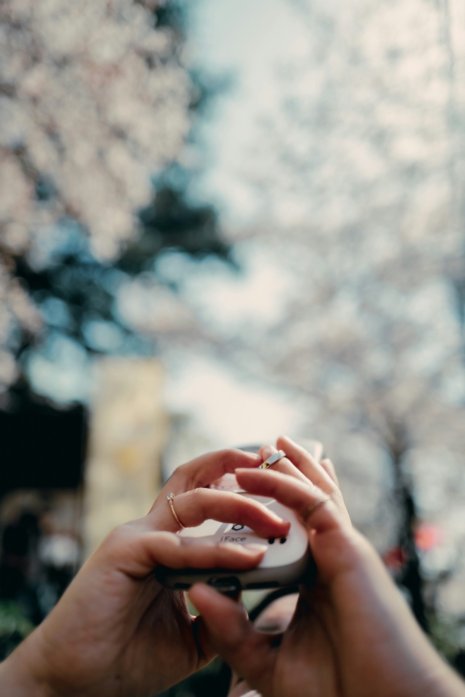 hands operating a small camera