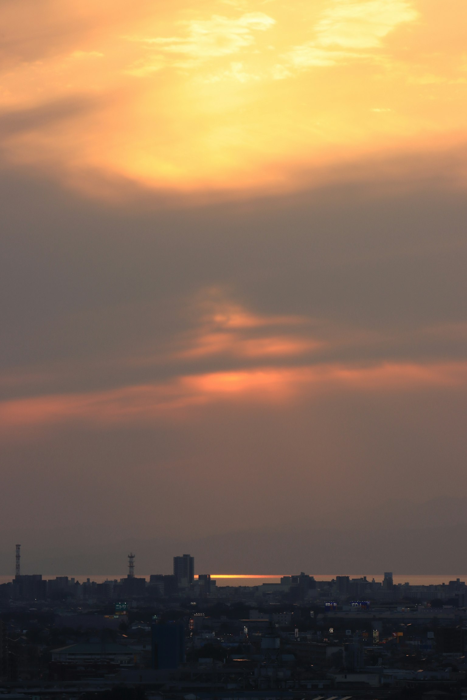Orange clouds in the evening sky with a tranquil sea view