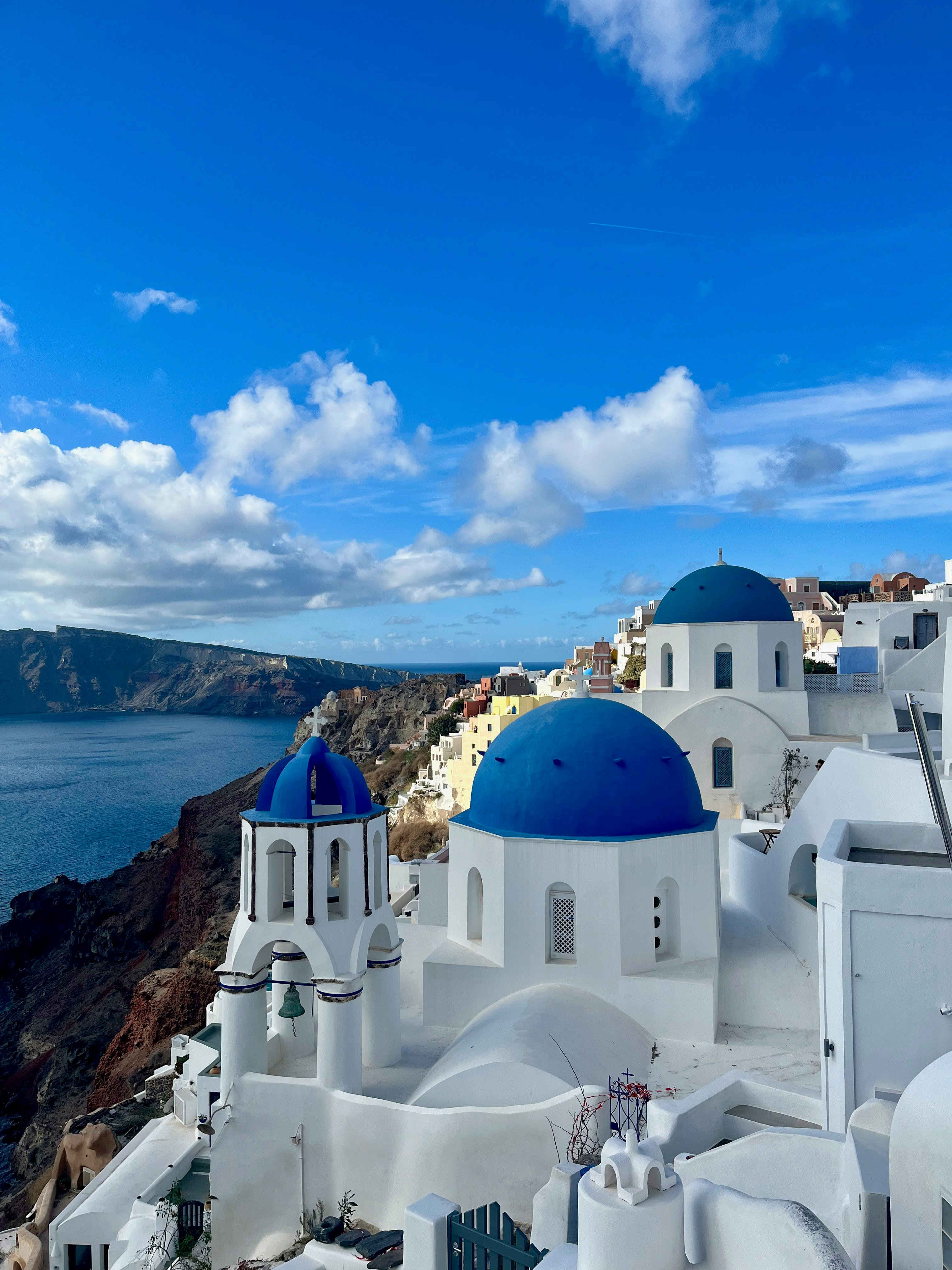 Santorini seaside townscape with blue domes and white buildings