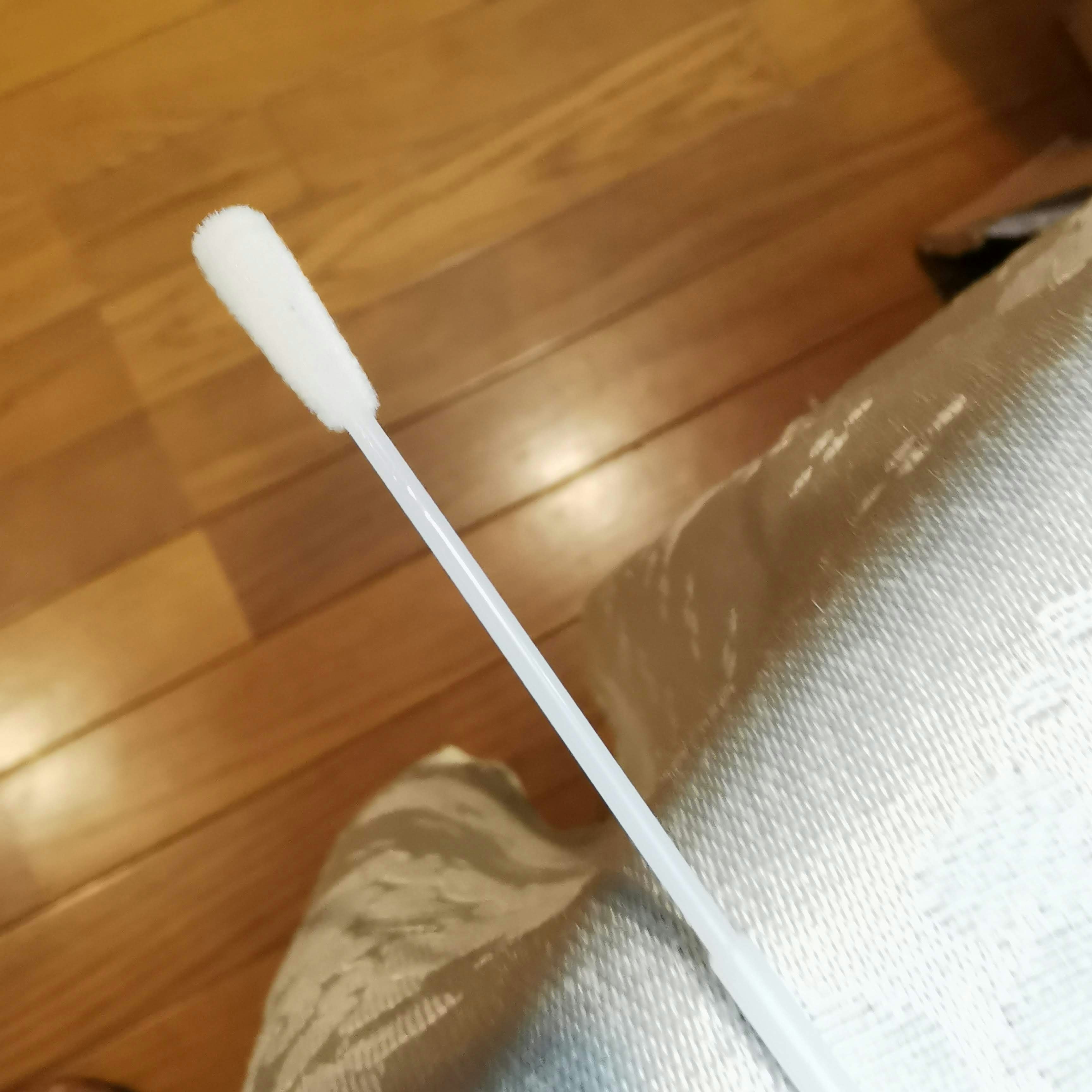 white mop and floor cleaning cloth on wooden floor