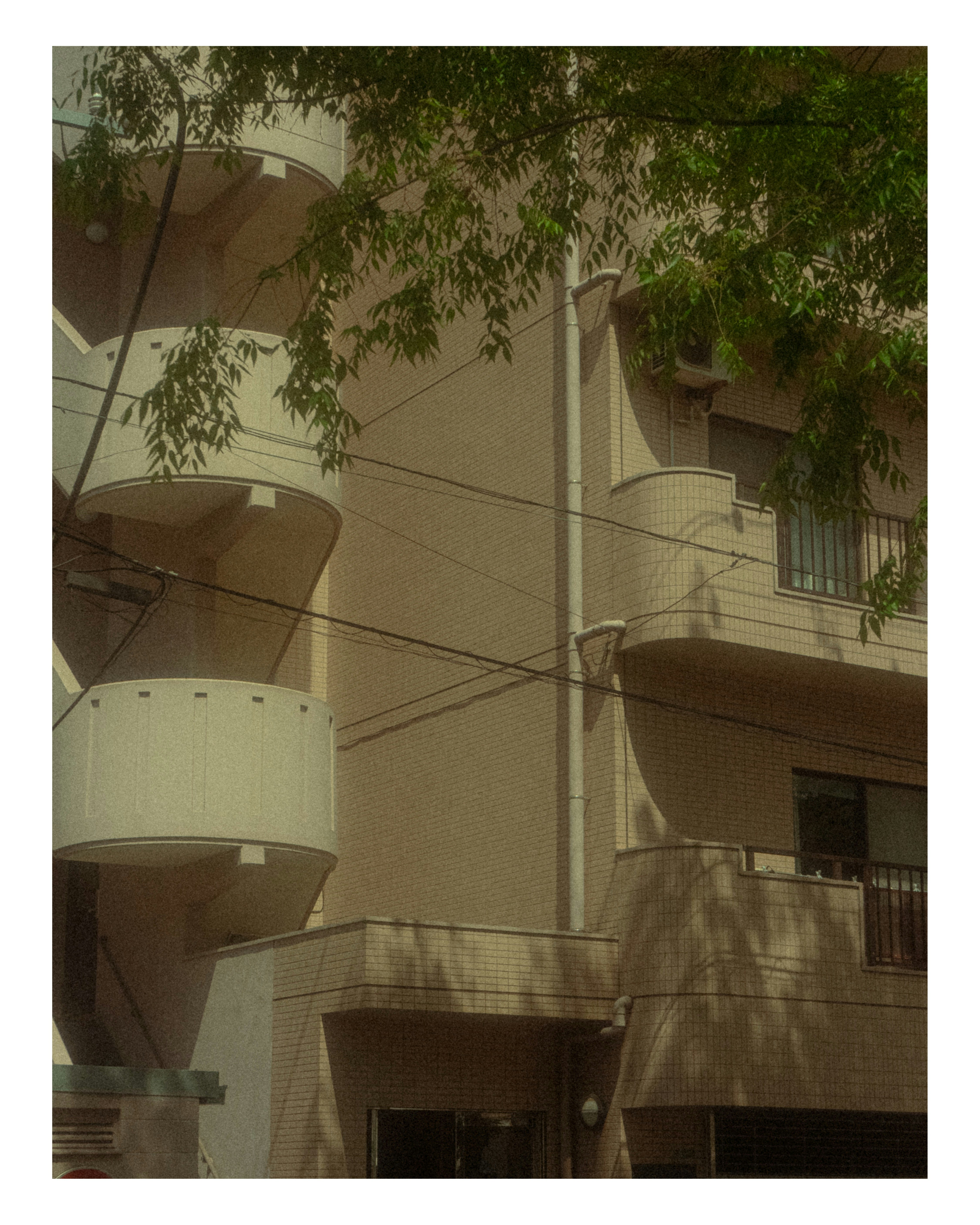 courtyard view with industrial tanks and pipes