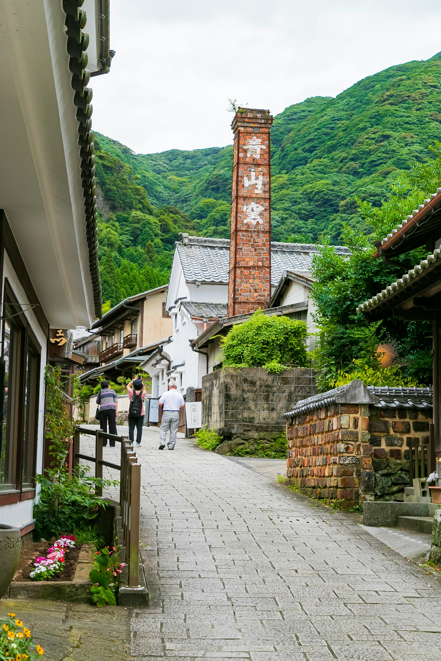Scenic view of a historic street with traditional buildings and a chimney