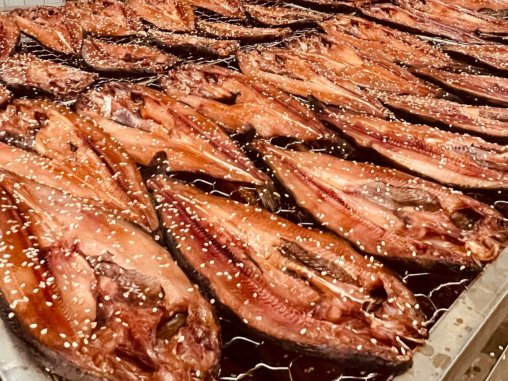 baked salmon fillets arranged on a tray