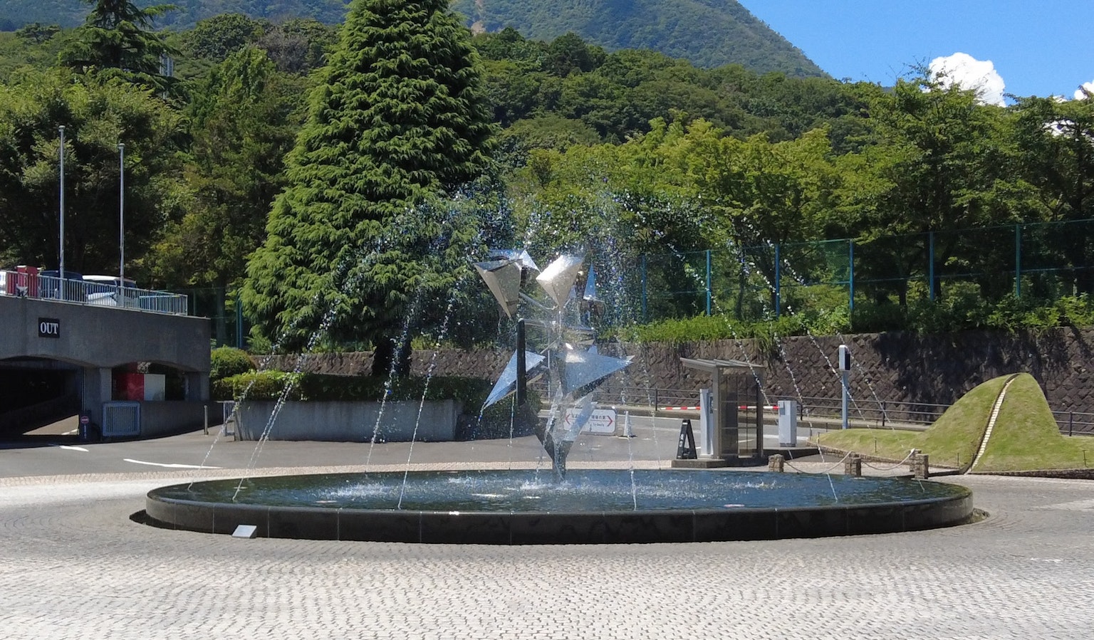 Fountain surrounded by greenery in a park setting