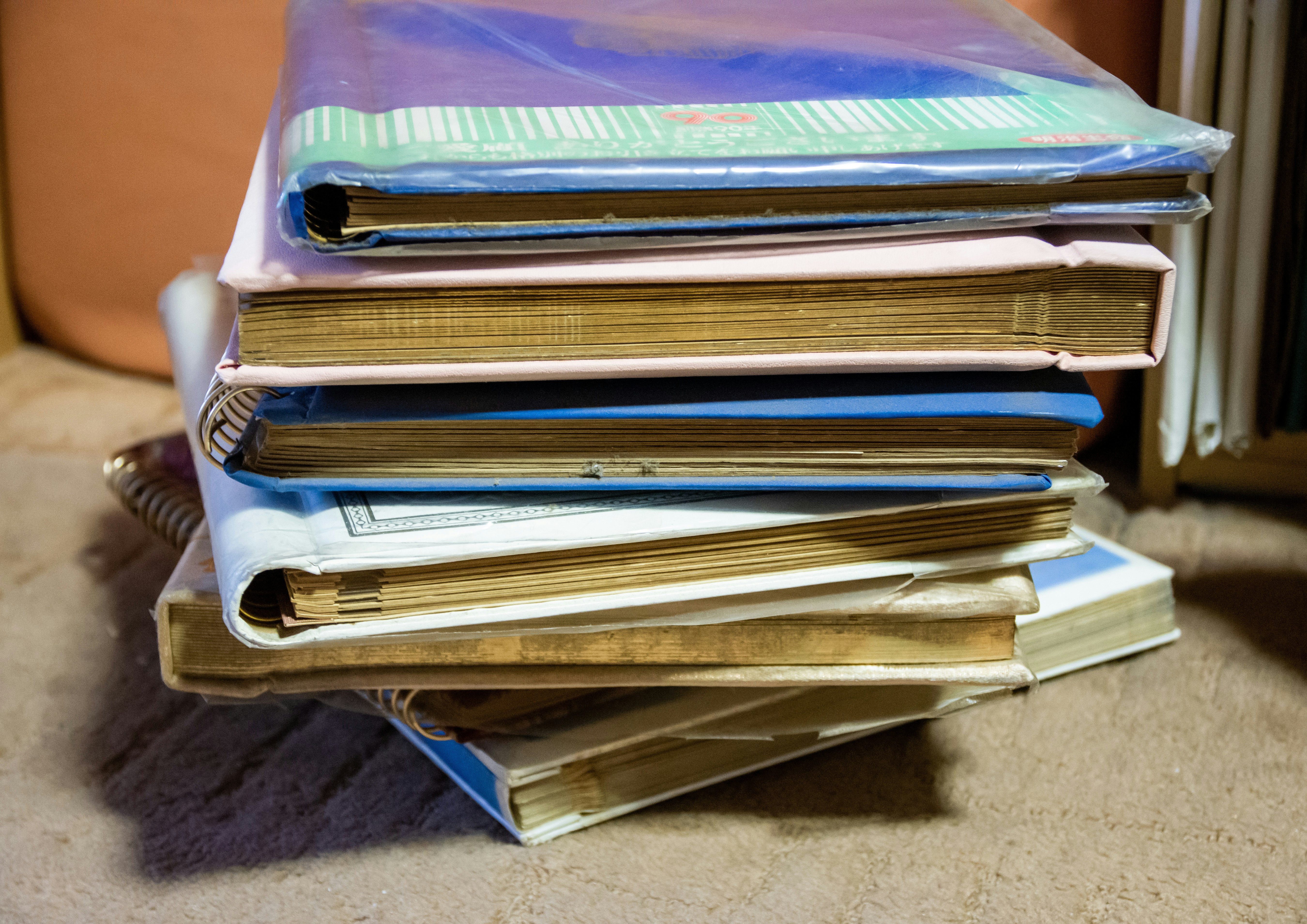 Stack of books with visible covers and spines