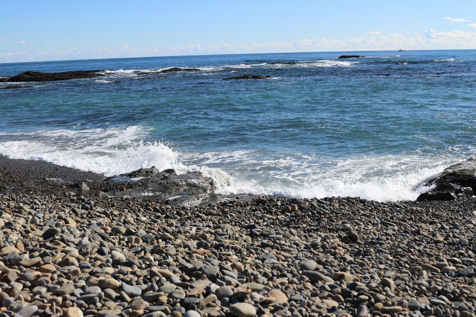 Rocky beach with waves crashing against the shore
