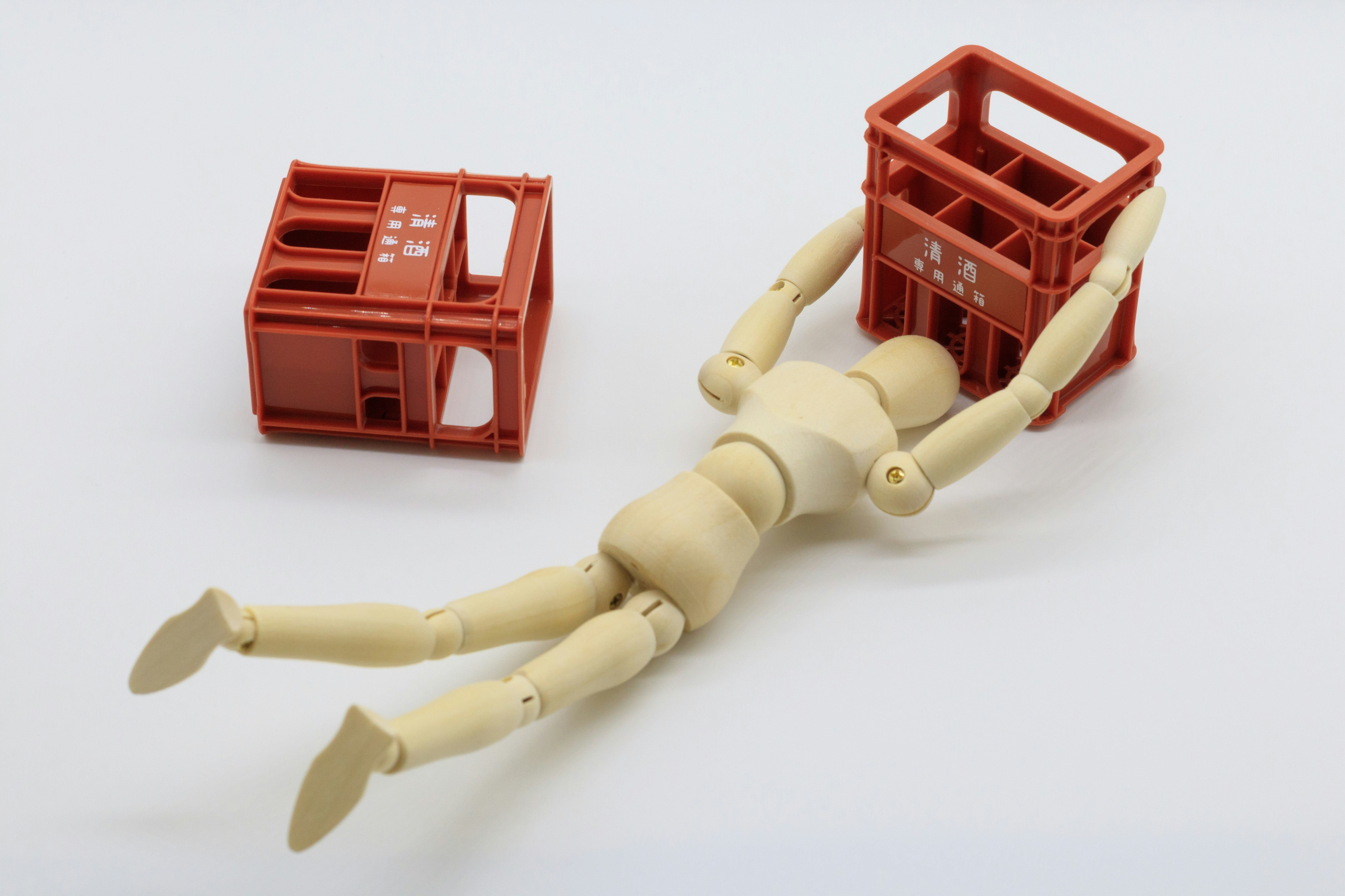 articulated mannequin figure with plastic crates