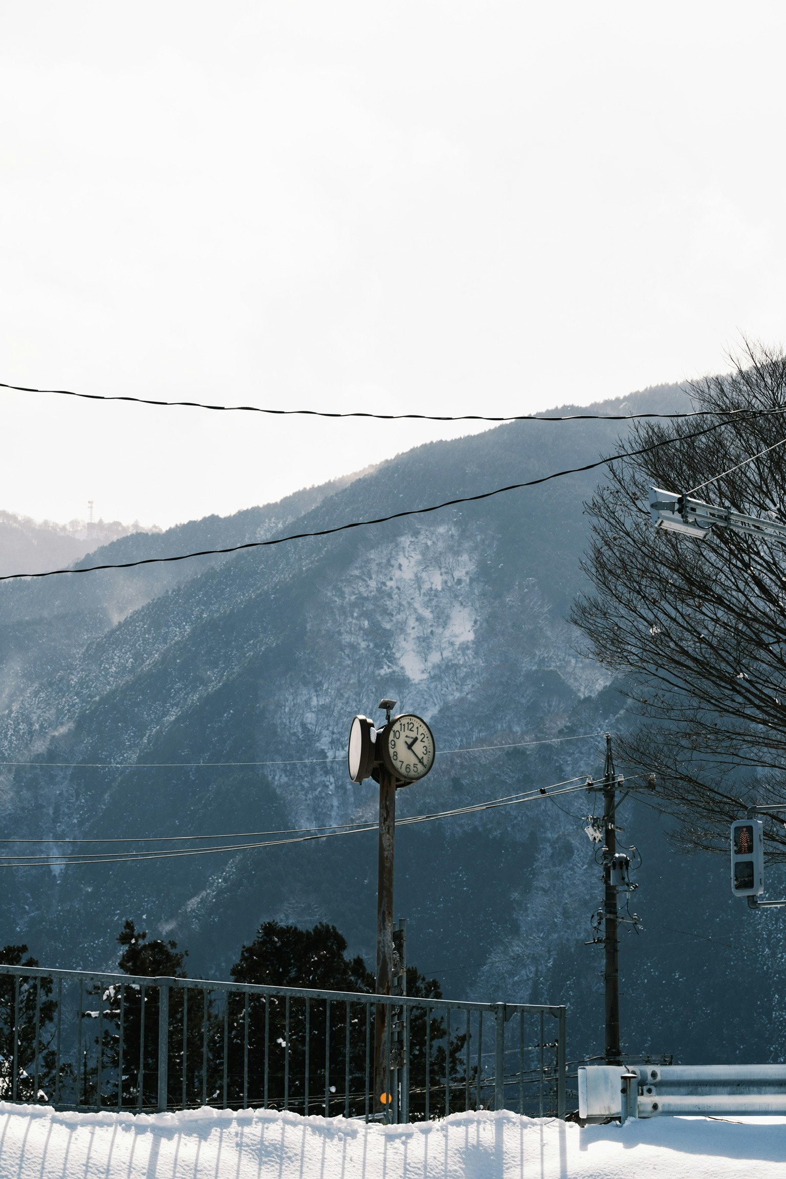 snow-covered viewpoint overlooking mountain ridges