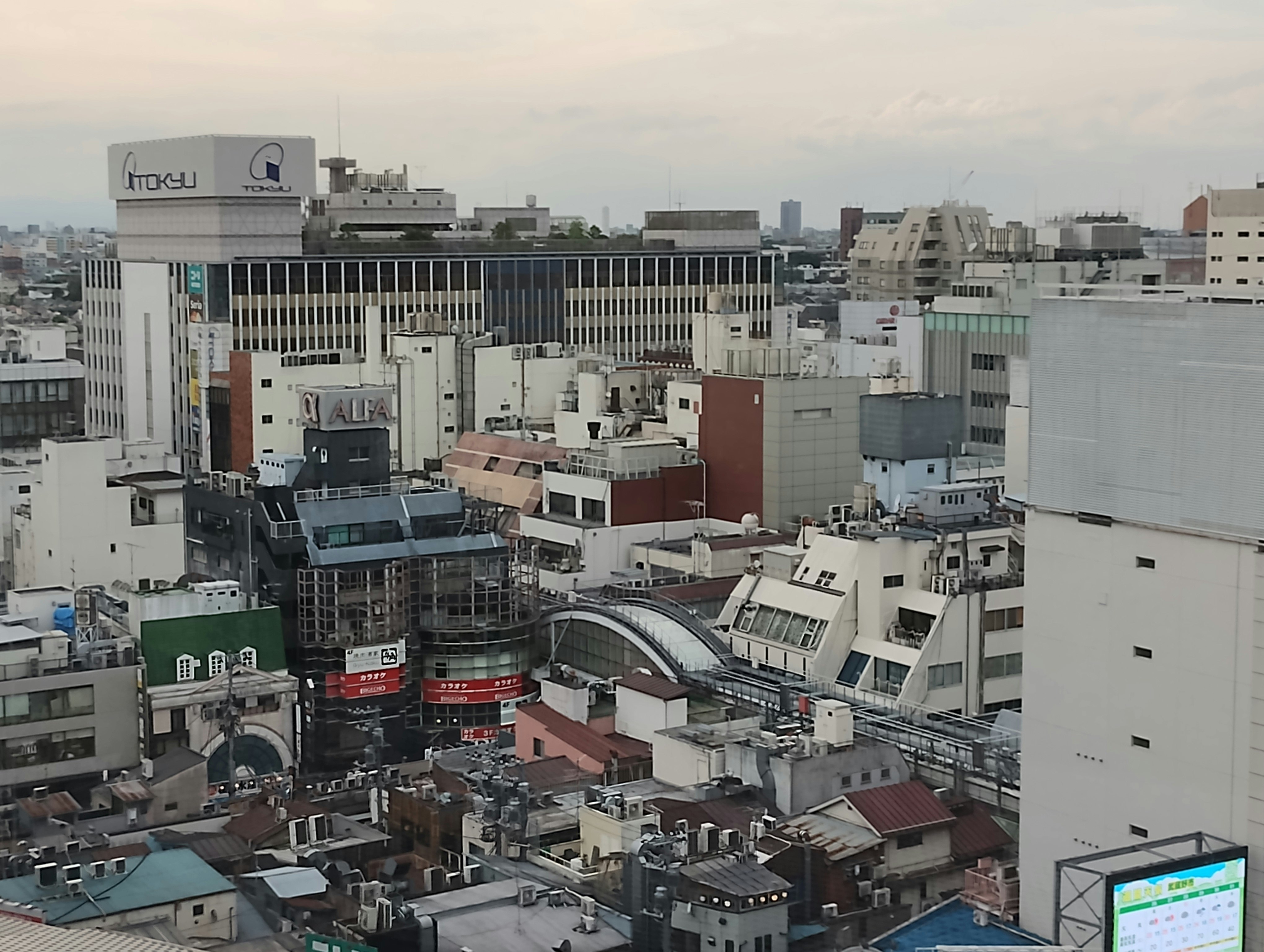 cityscape viewed from rooftops with dense buildings
