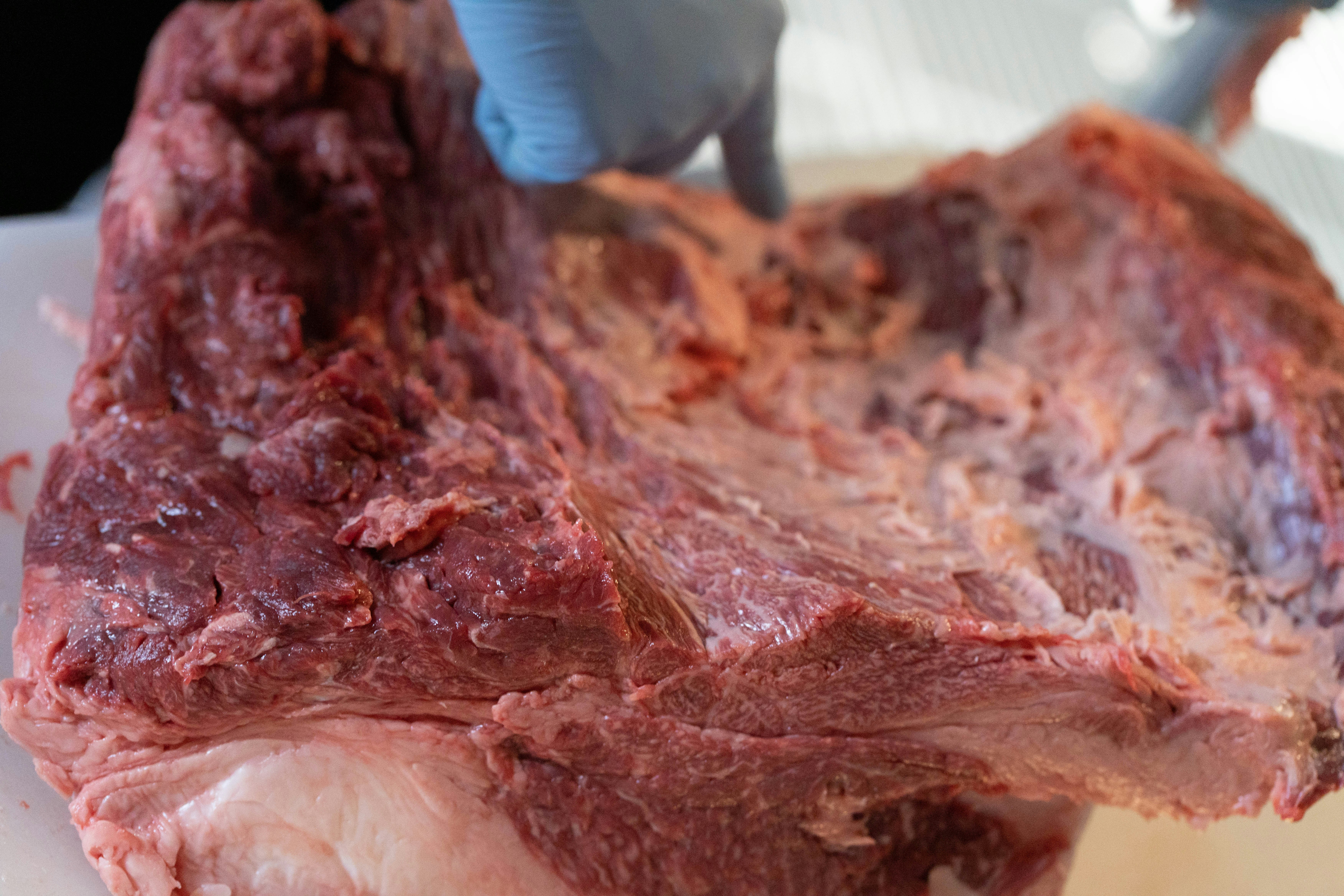 close-up of a butchered meat cut on a prep surface