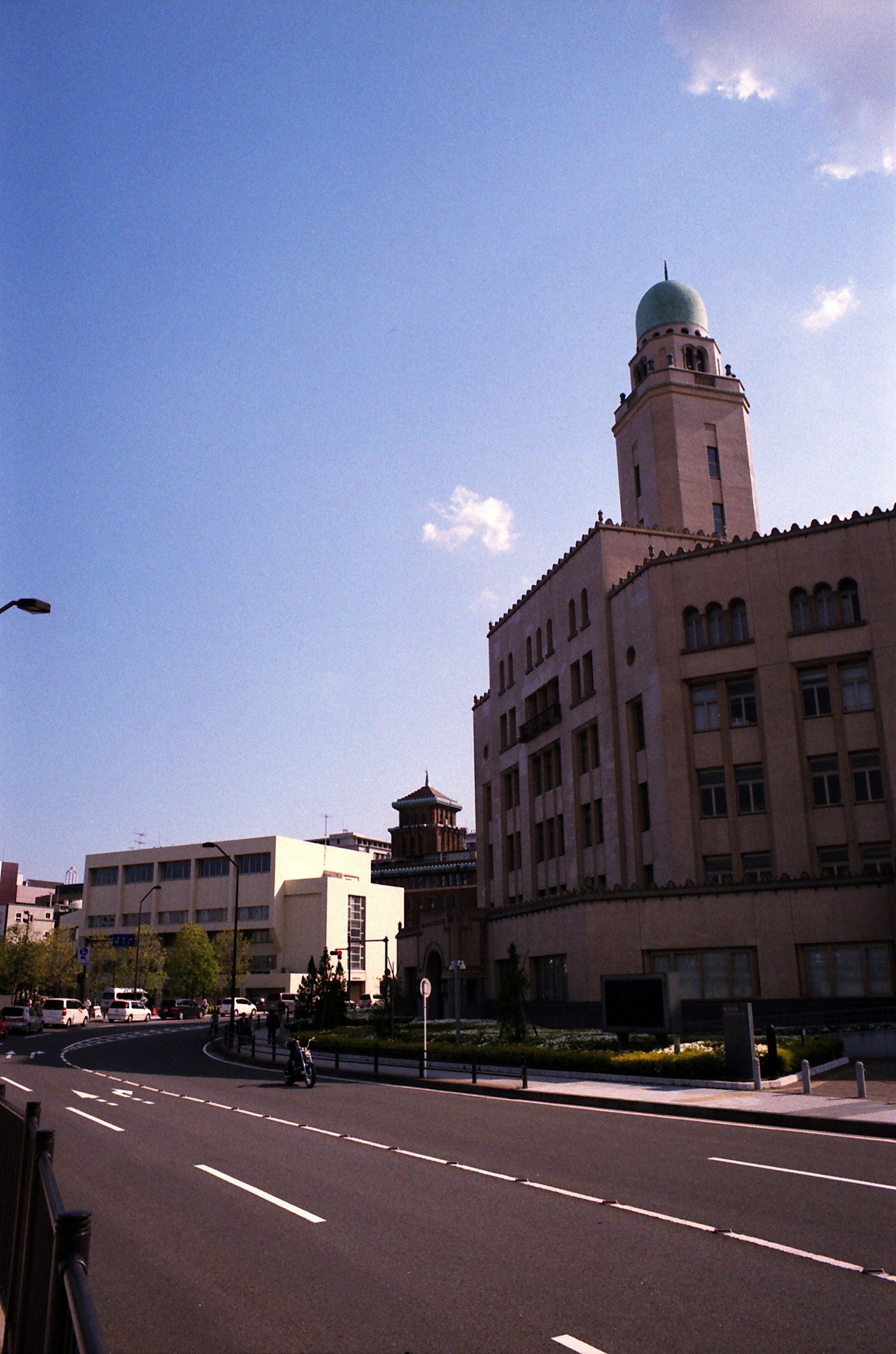 Historic building with clock tower under blue sky