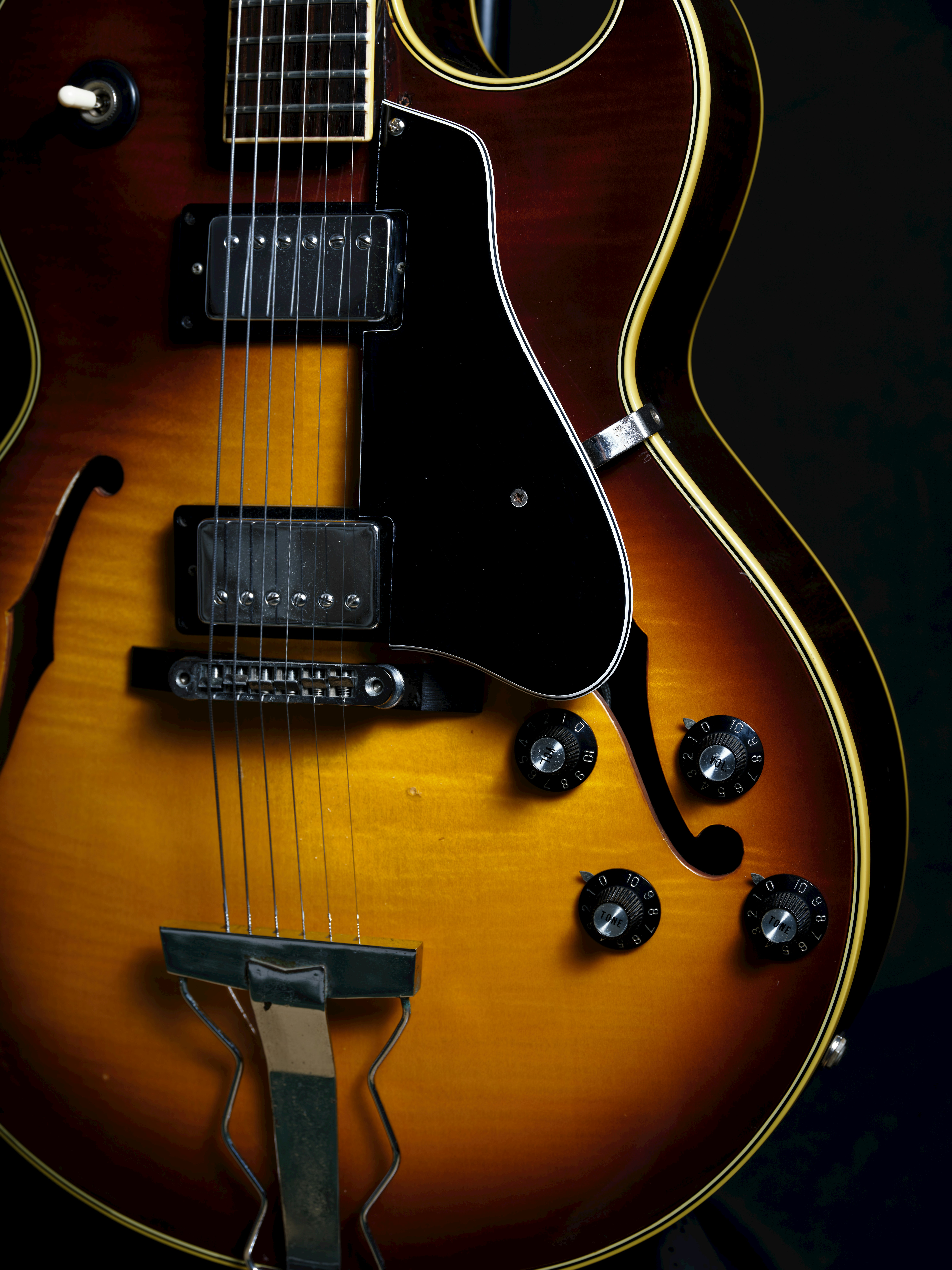 close-up of a sunburst electric guitar
